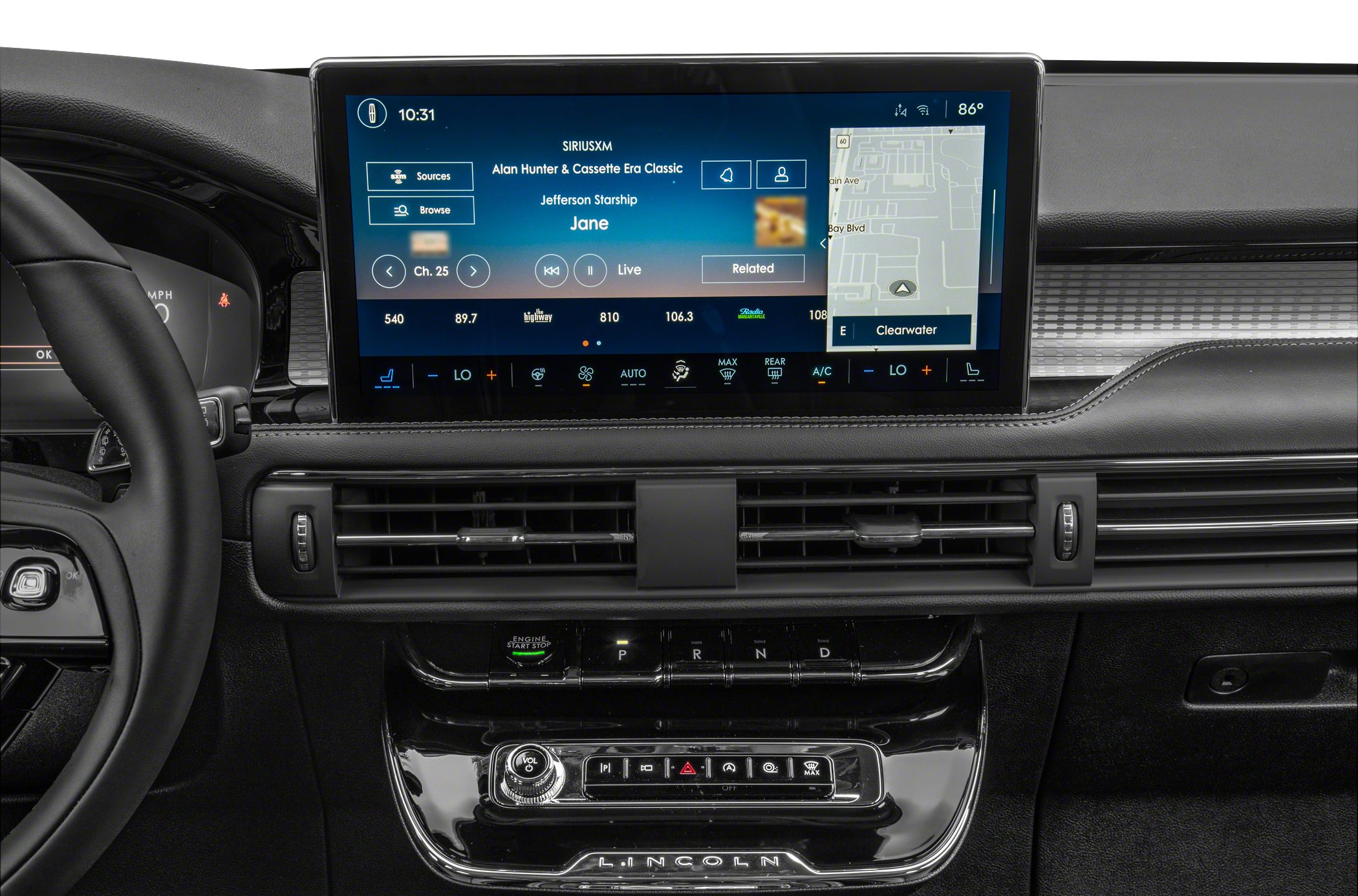 Modern infotainment display and dashboard controls with digital navigation and climate settings