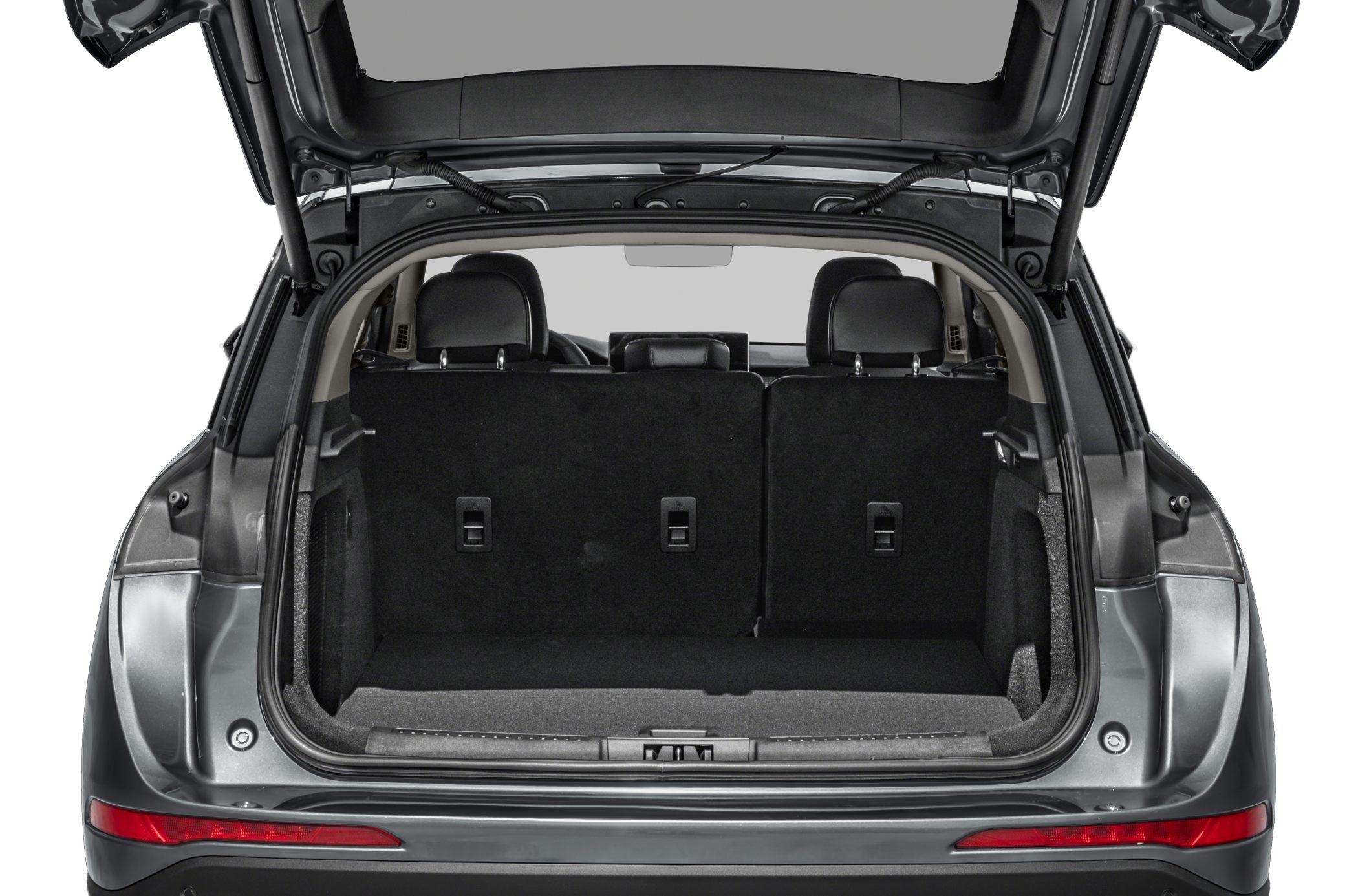 SUV rear cargo area with folded rear seats and spacious trunk