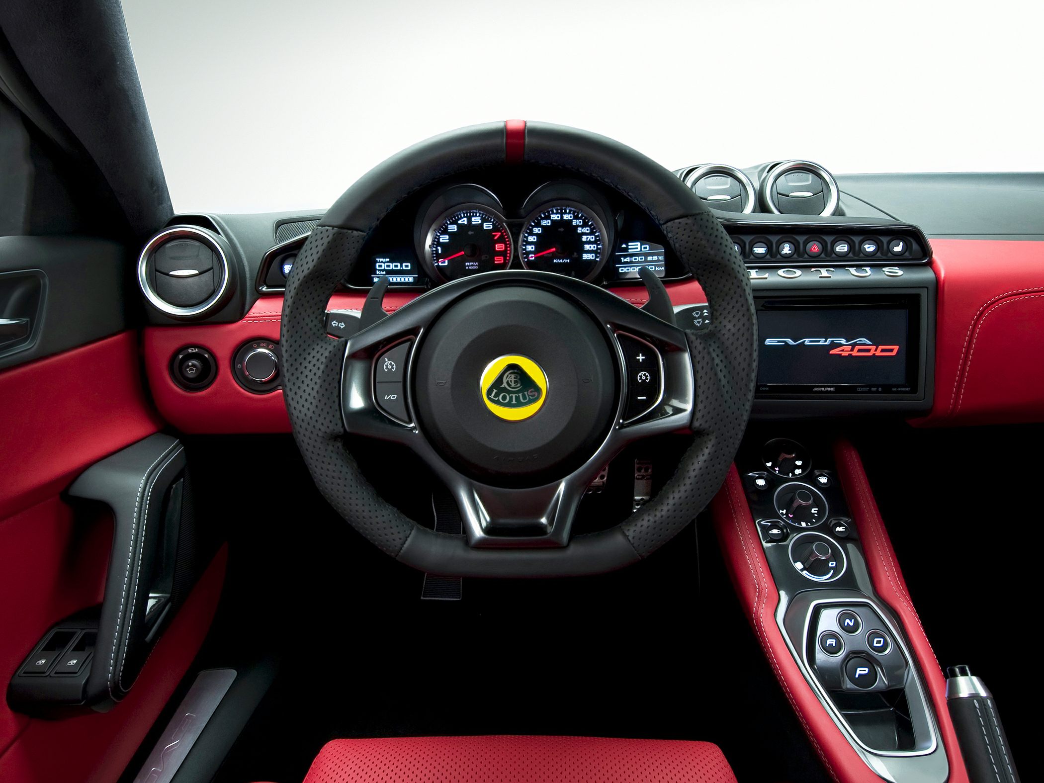 Sporty steering wheel, digital gauges, and central console with controls