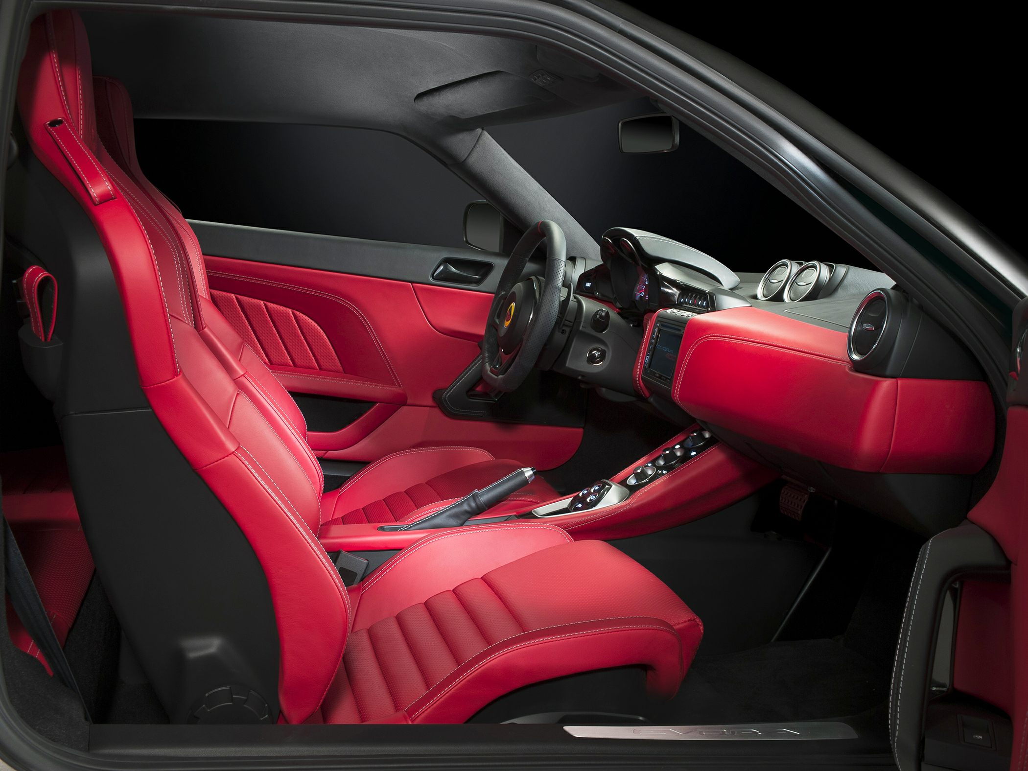Red leather sporty seats and dashboard interior with modern controls