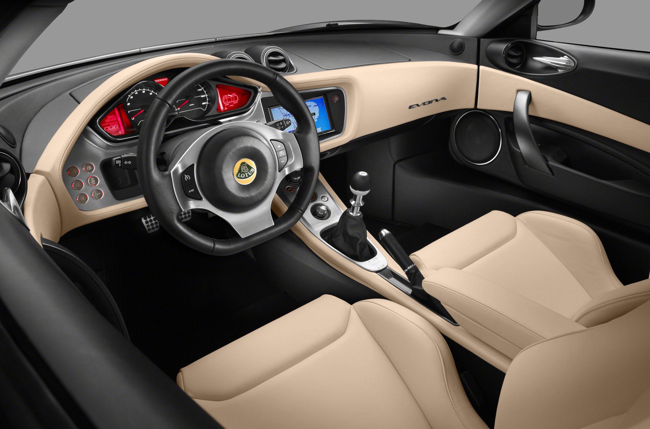 Interior dashboard with manual gear shift and beige leather seats