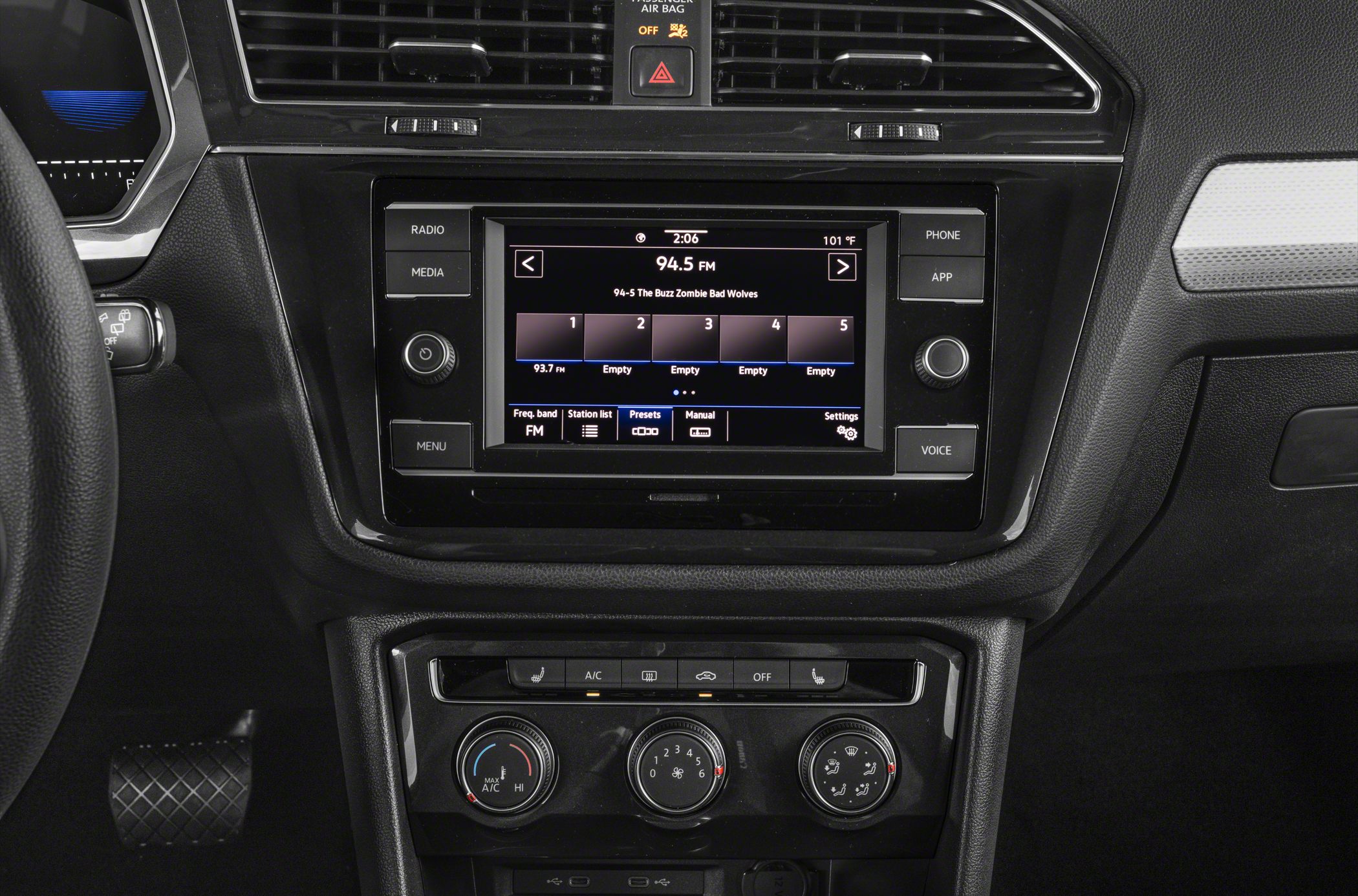 Infotainment touchscreen and climate control dials with buttons