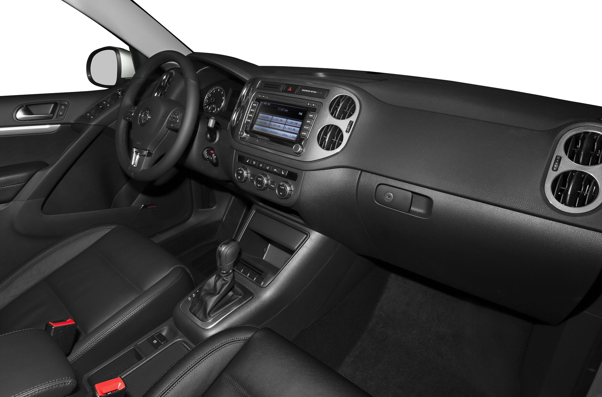 Car interior with dashboard, touchscreen, and steering wheel