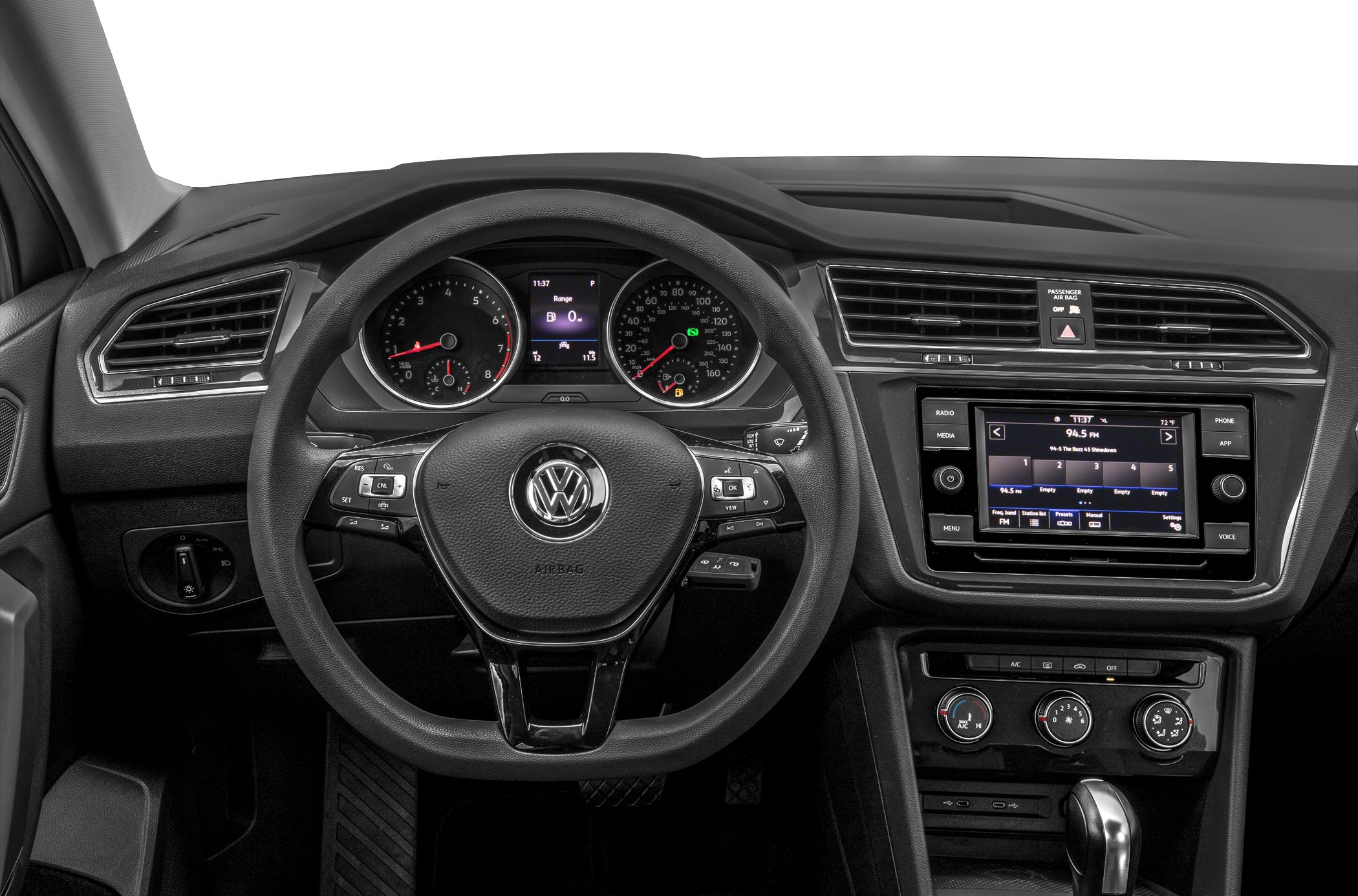 Dashboard with digital gauge cluster and multi-function steering wheel.