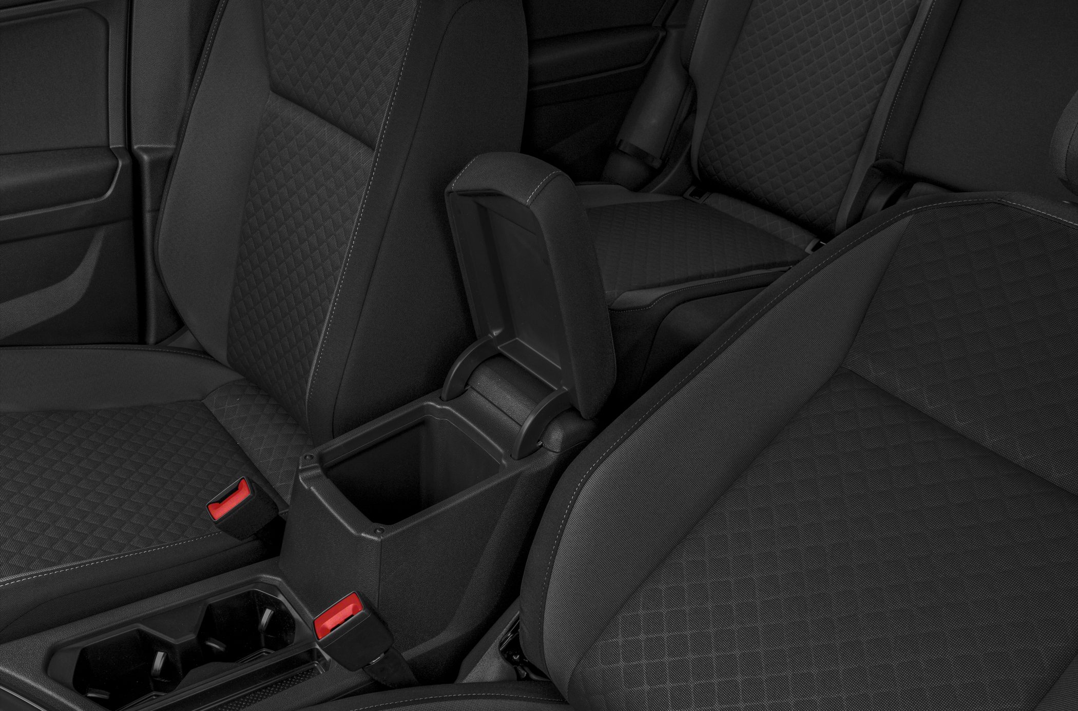 Fabric car seats and open center console storage in front row
