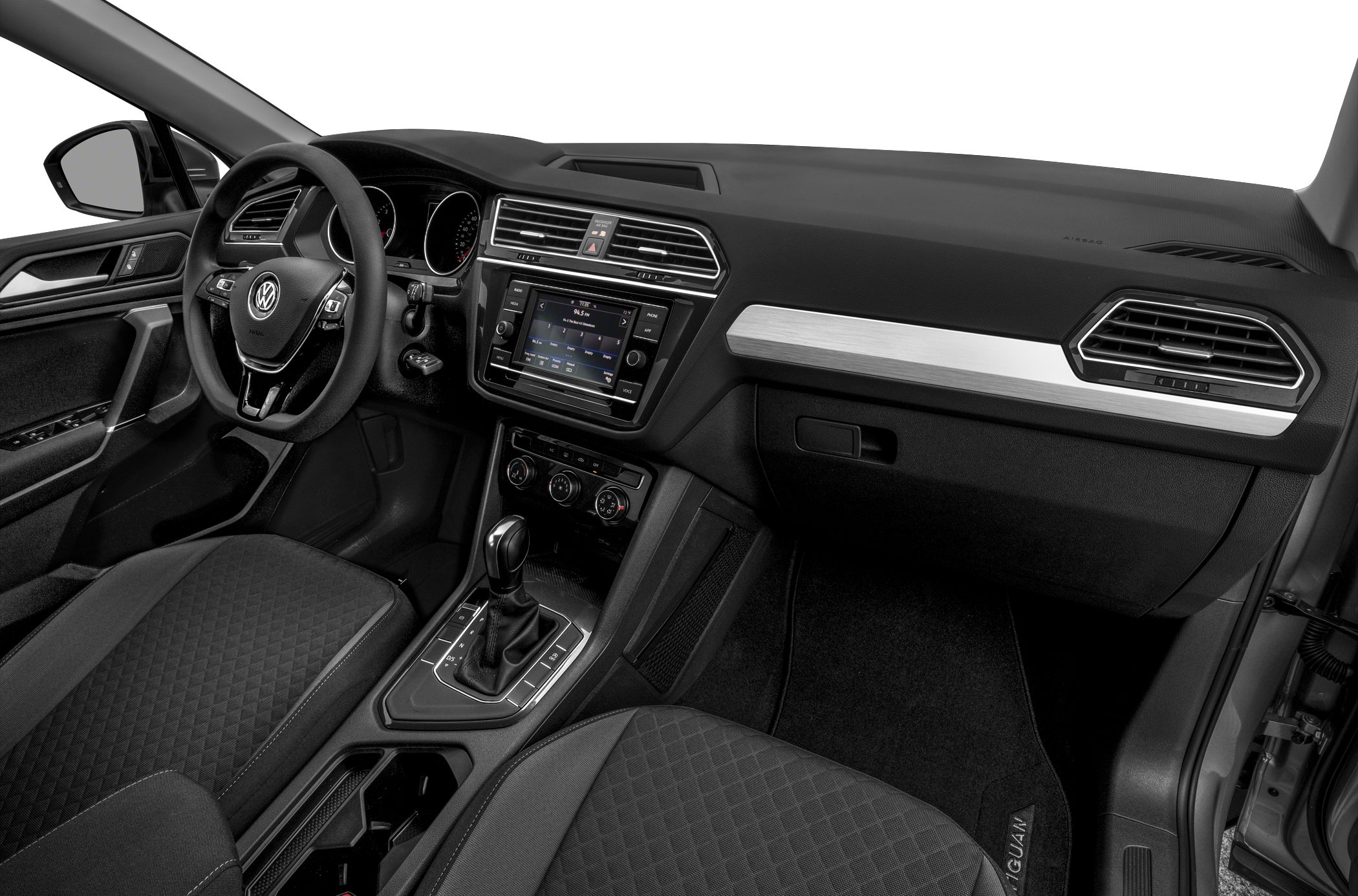 Car interior showcasing dashboard, steering wheel, infotainment, and gear shift
