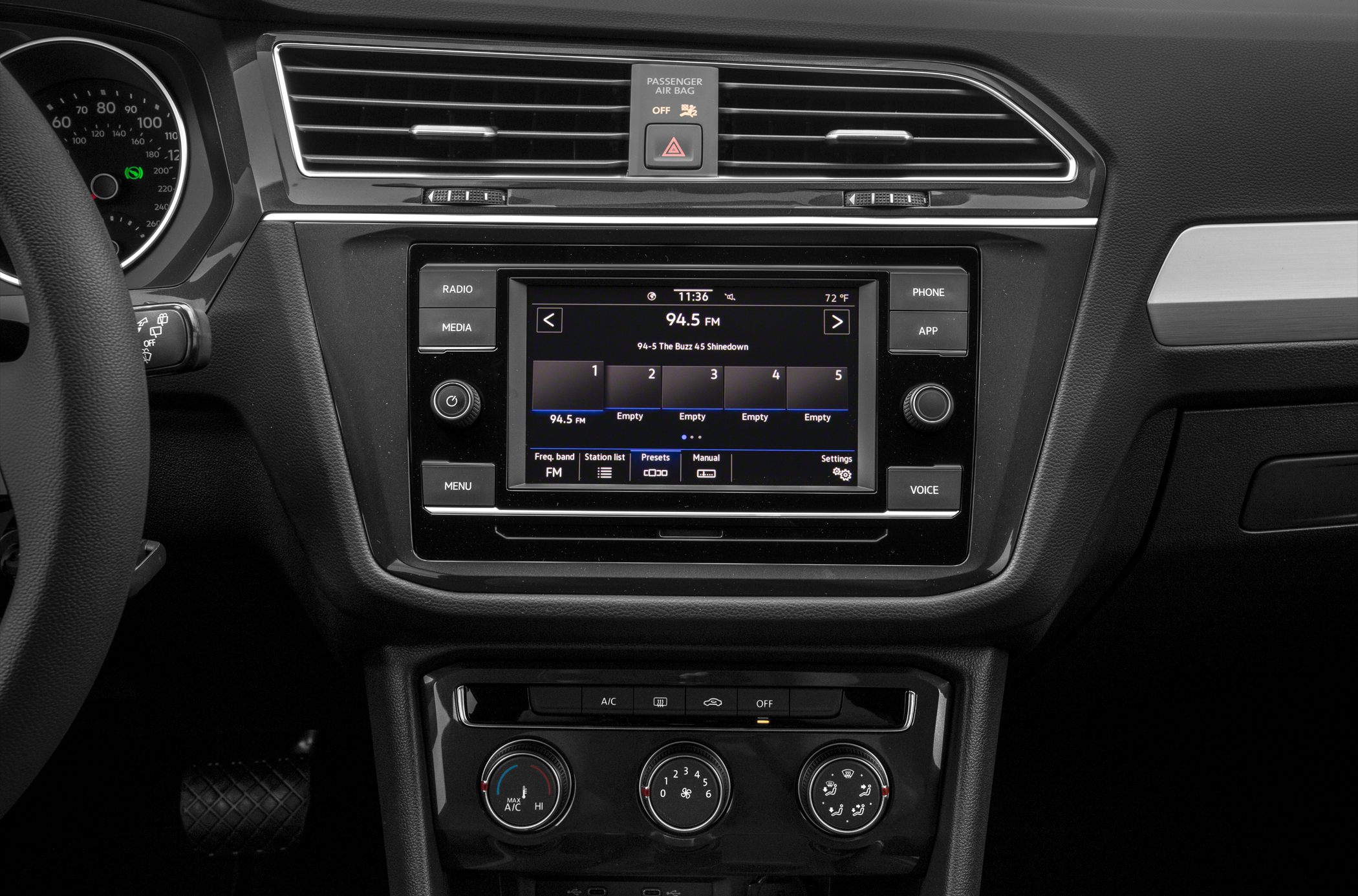 Central infotainment touchscreen and manual climate control dials