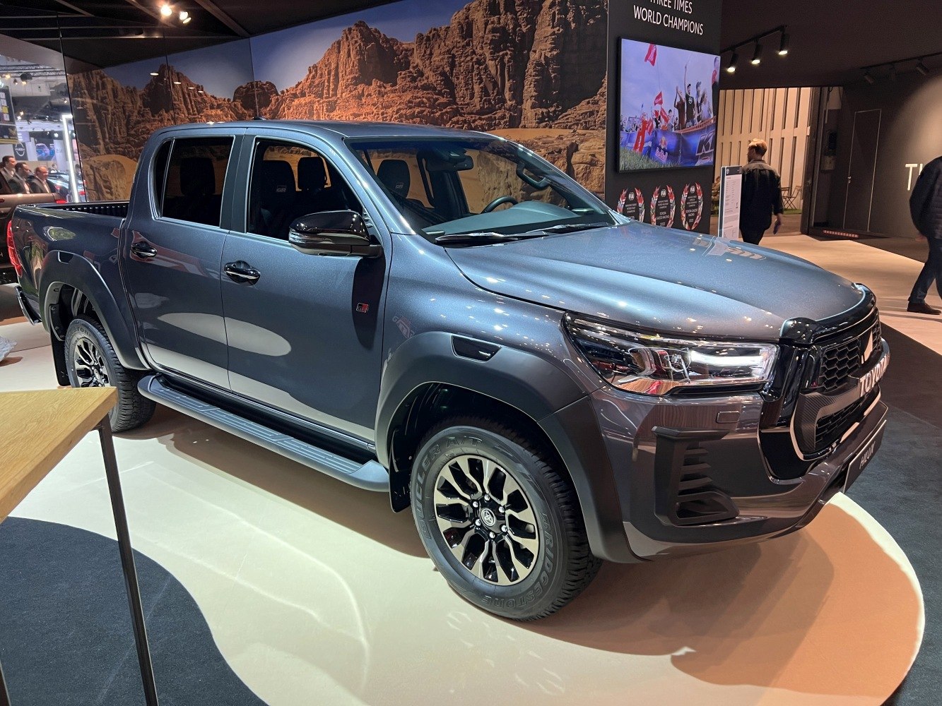 Front and side view of a modern pickup with distinctive headlights and rugged styling.