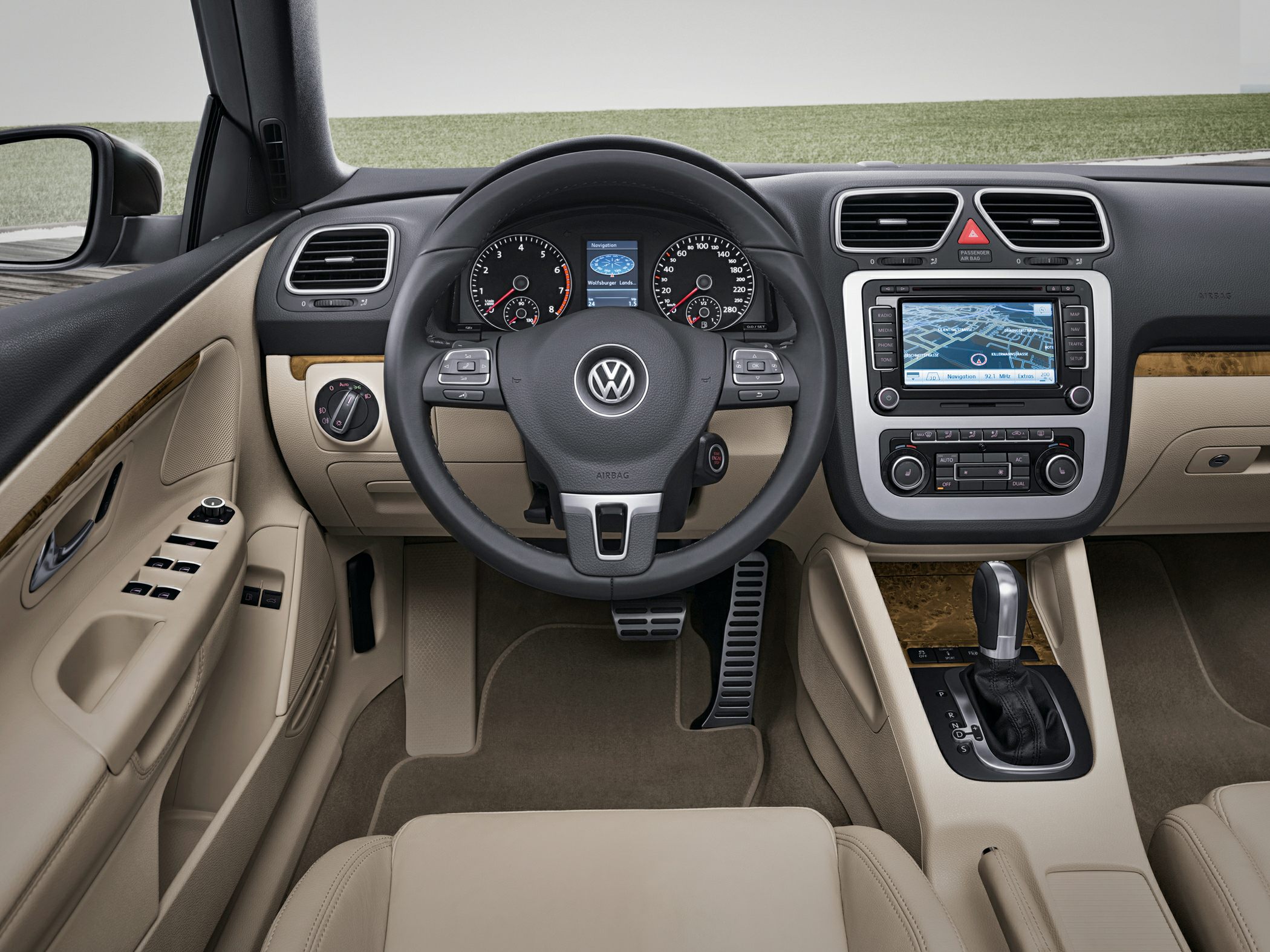 Beige car interior with navigation and automatic gear shift
