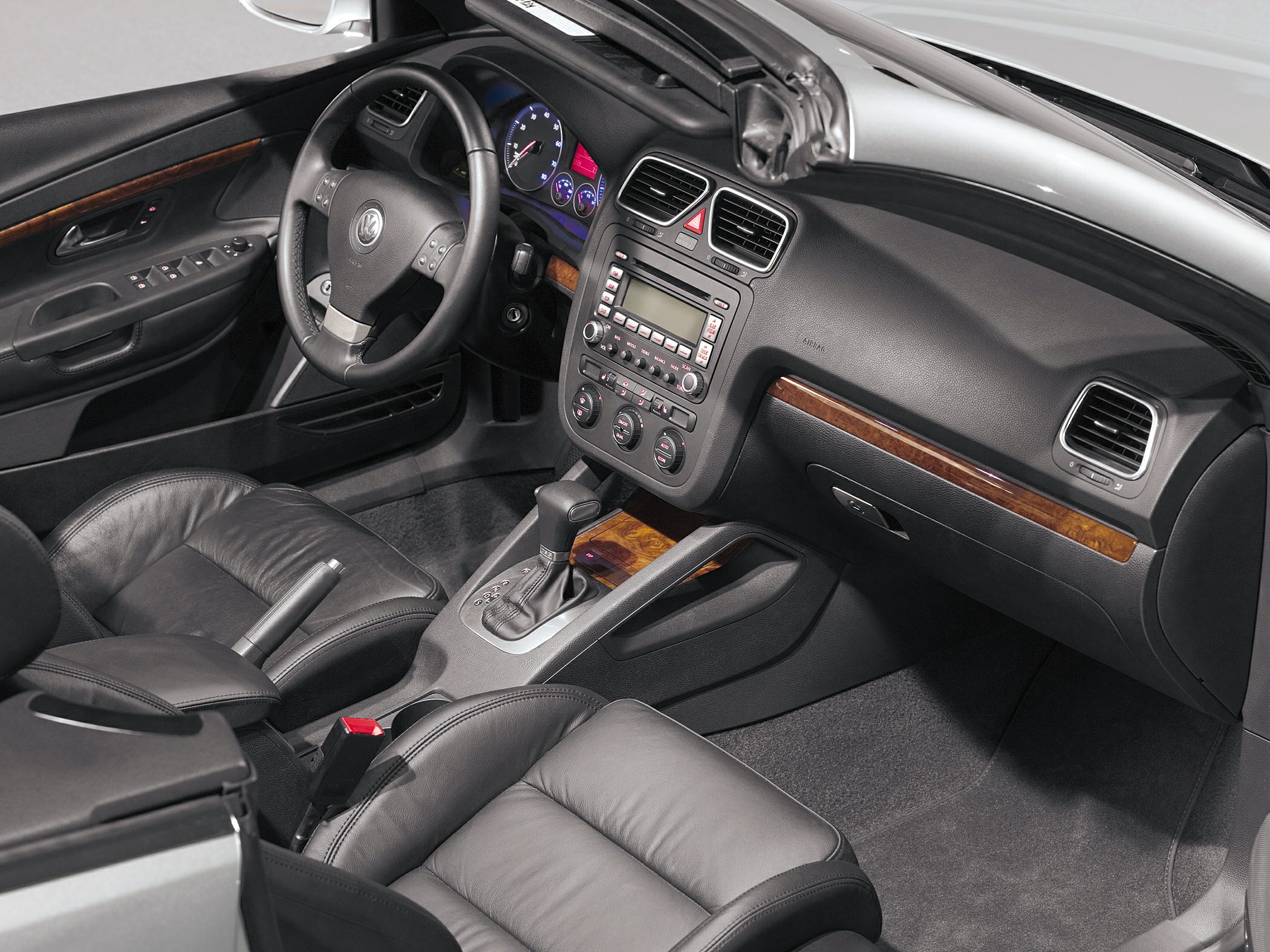 Leather seats interior with dashboard and wood trim accents