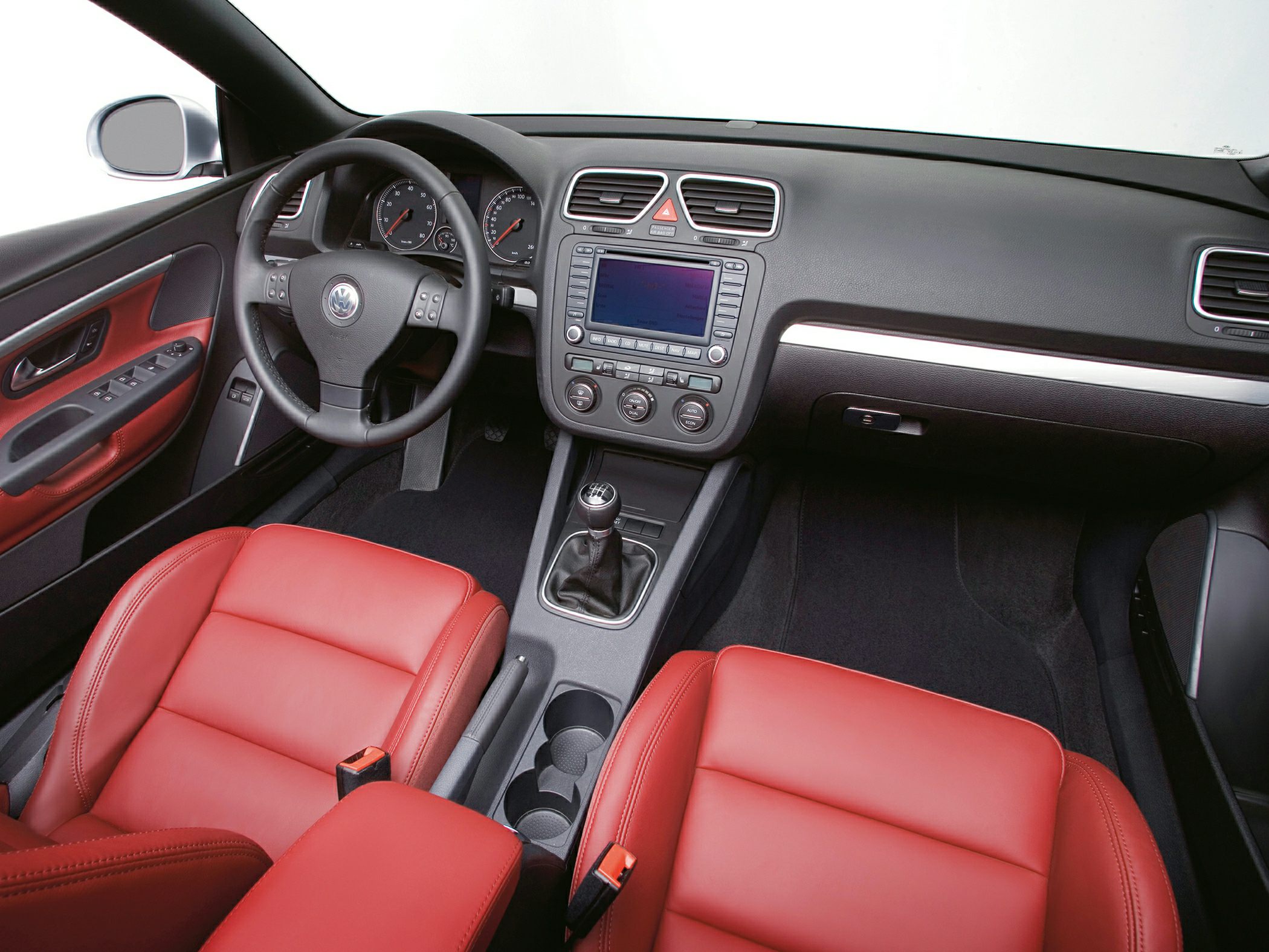 Interior dashboard with manual transmission and red leather seats