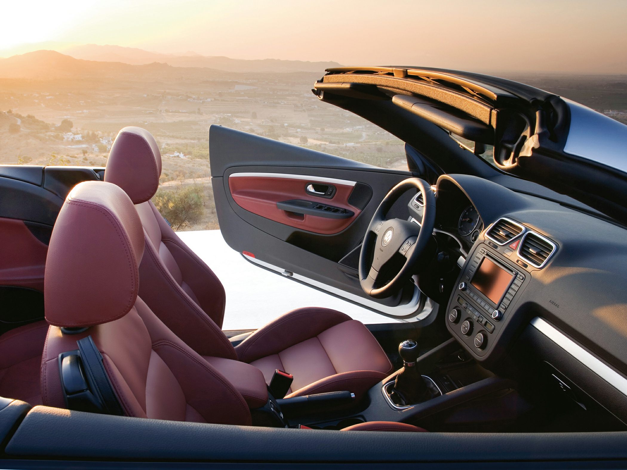 Convertible roof interior with leather seats and manual gearshift