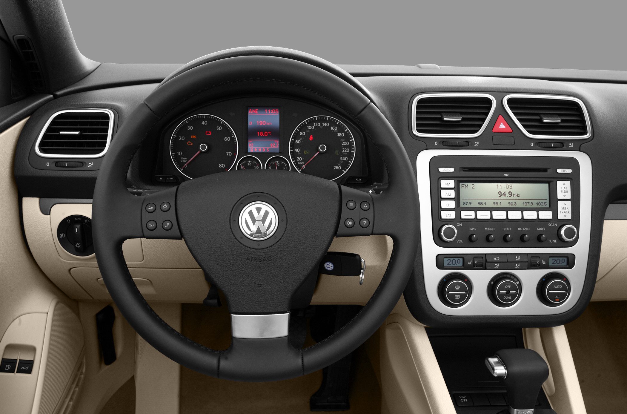 Multifunction steering wheel and detailed dashboard with radio and climate controls