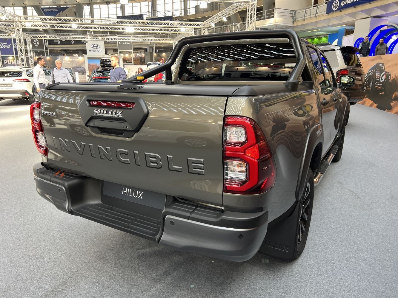 Rear view of pickup truck with Invincible badge and LED tail lights