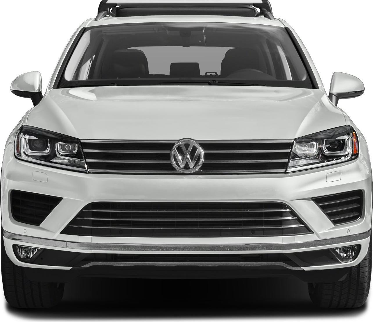 Front view with LED headlights, horizontal grille, and roof racks