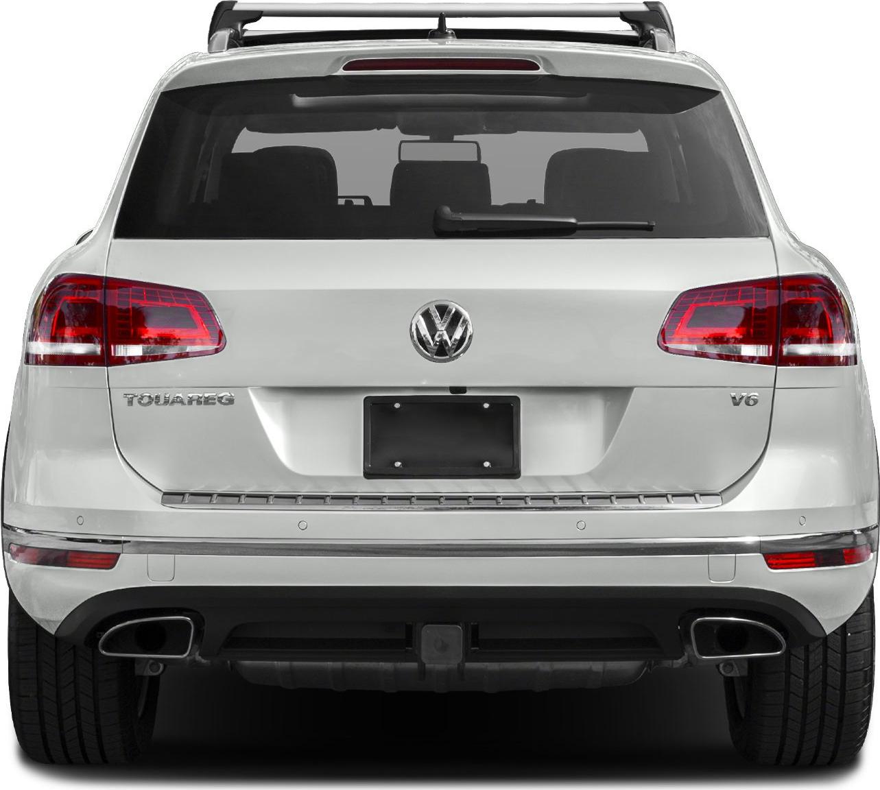 Rear view of SUV with dual exhausts, roof rails, taillights, and V6 badge