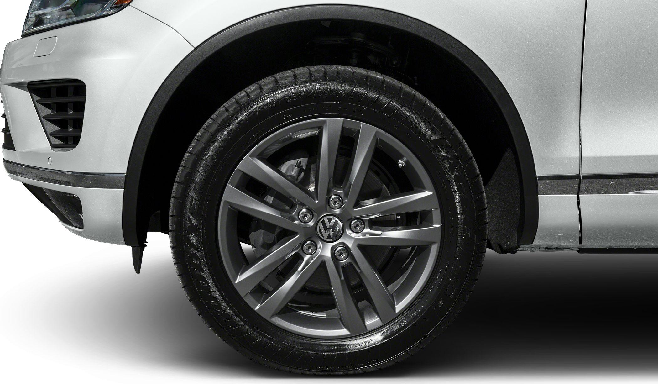 Close-up of multi-spoke alloy wheel and tire on SUV
