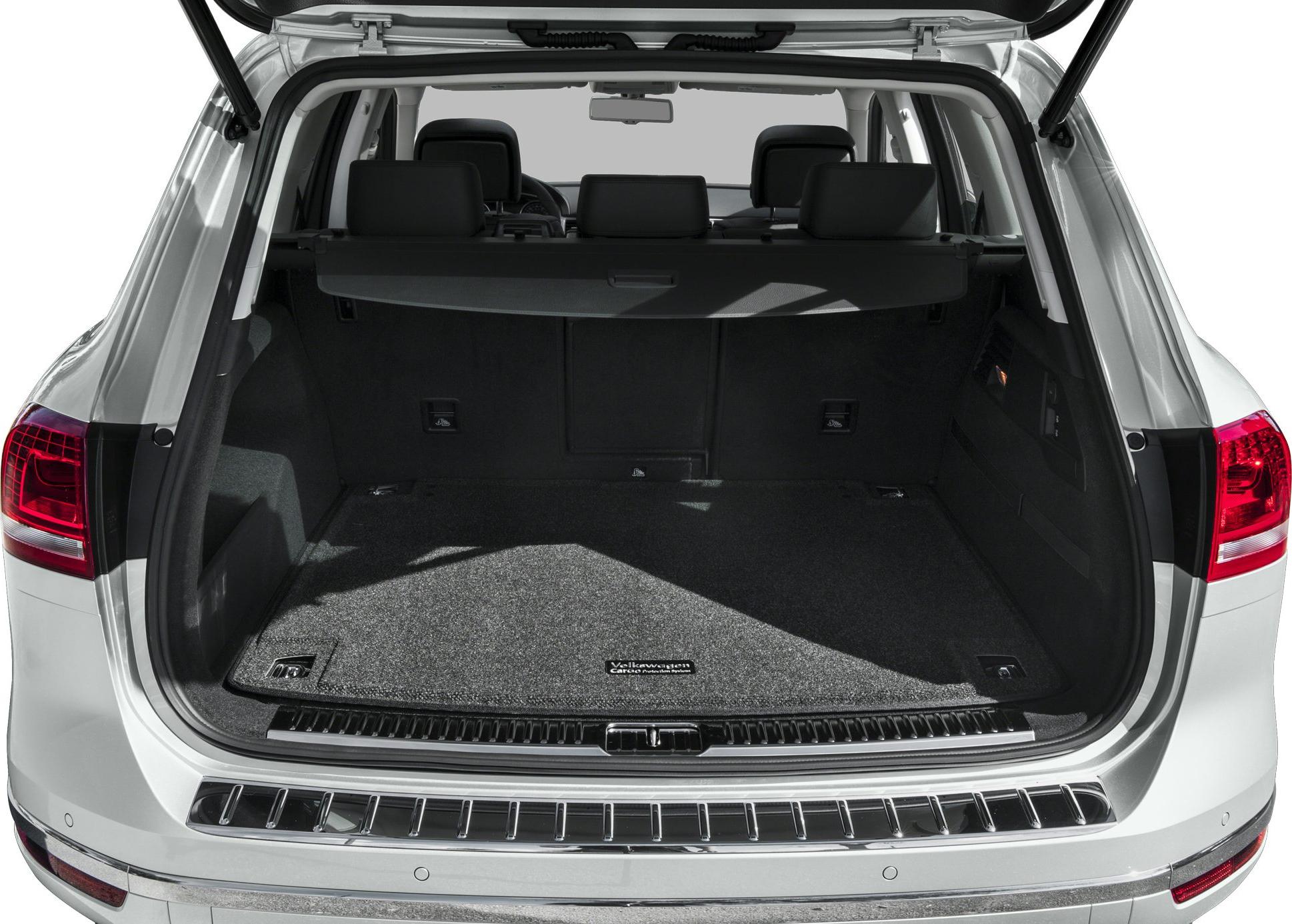 Spacious SUV trunk cargo area with protective mat and rear seats view