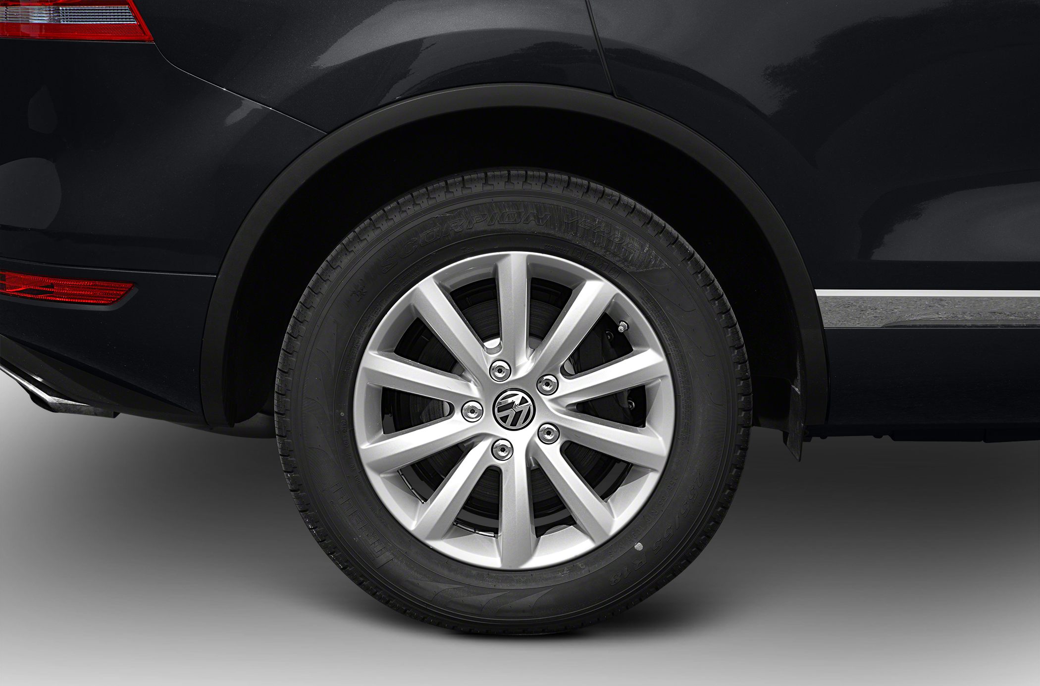Close-up of alloy wheel rim and tire on vehicle rear side