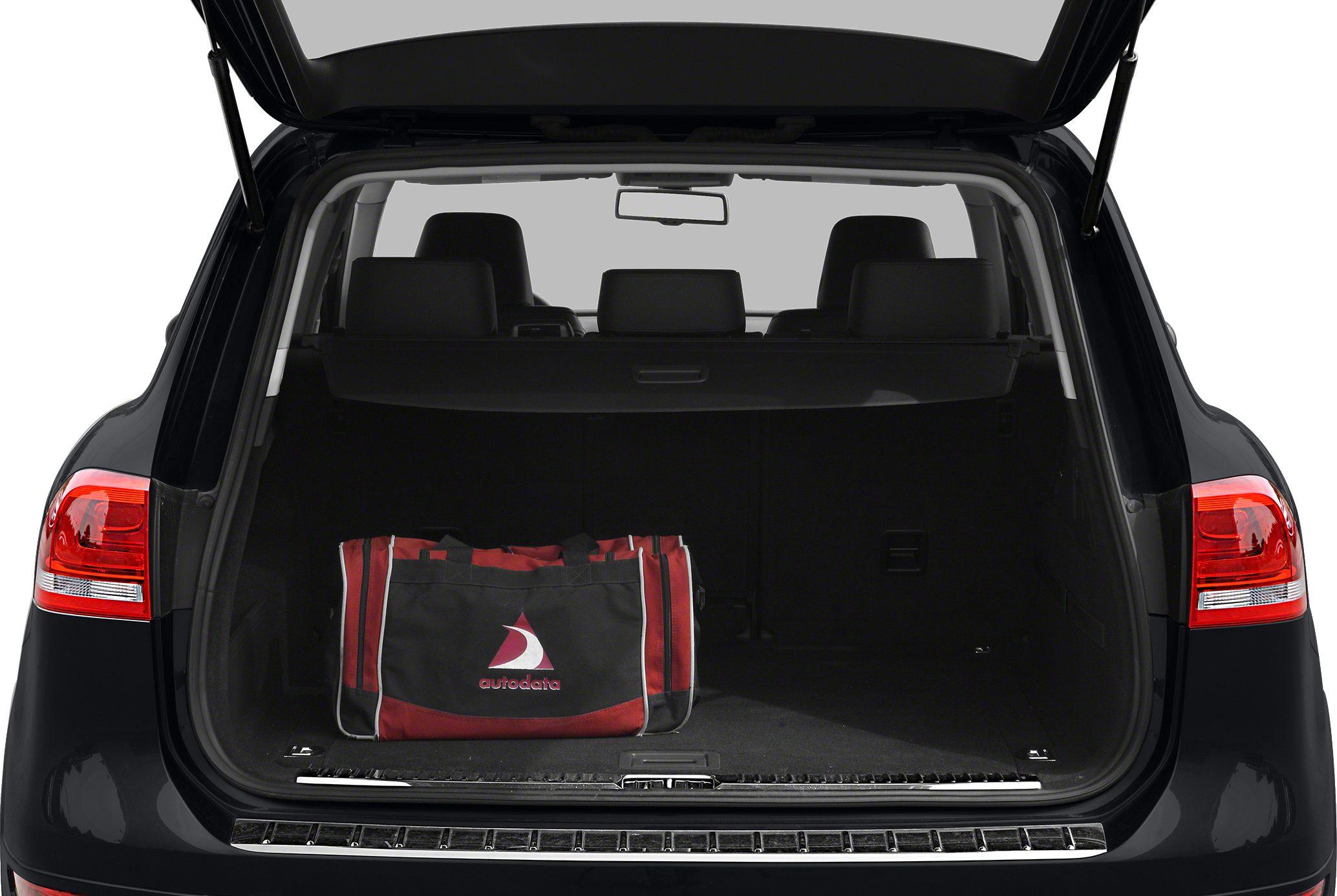 Open SUV trunk with cargo cover and bag inside