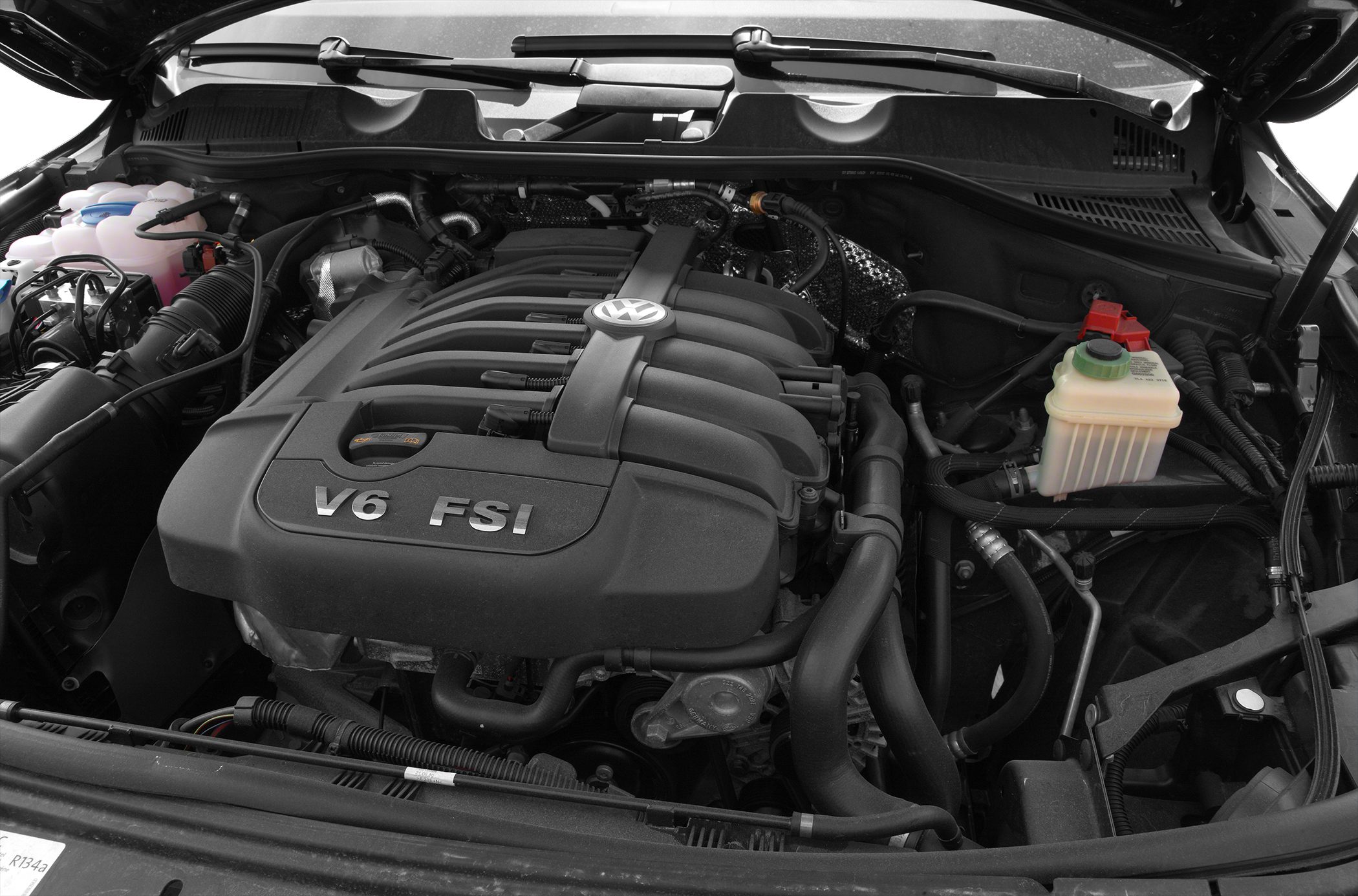 Close-up of V6 FSI engine with Volkswagen emblem and surrounding components