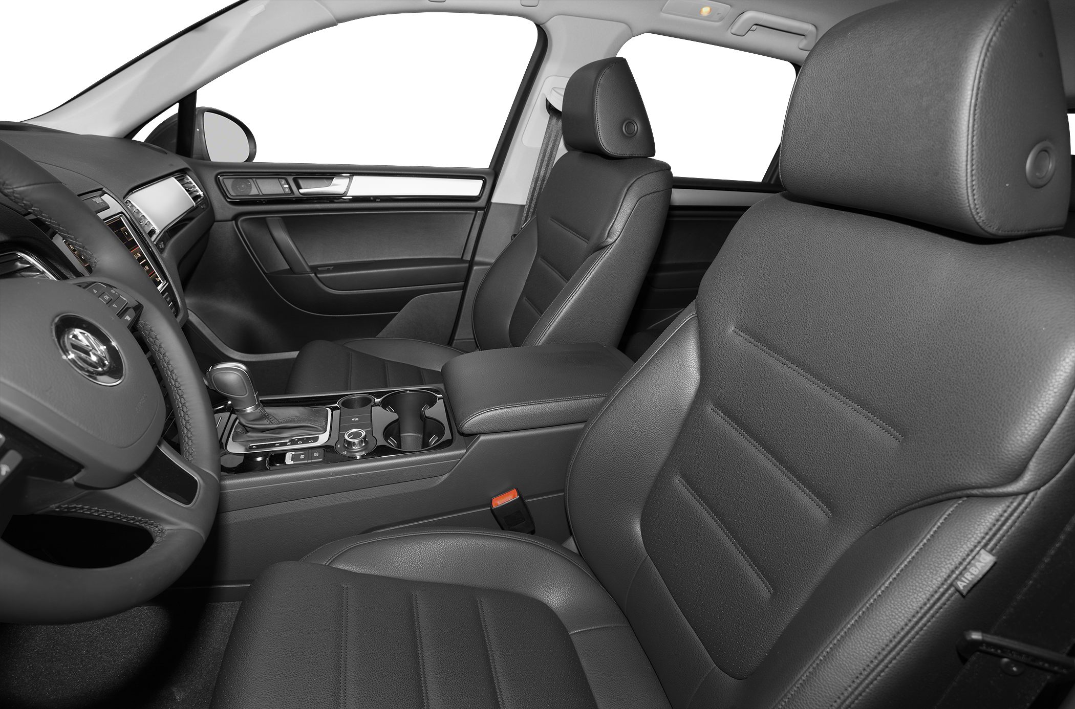 Black leather front seats and dashboard interior with gear shift and cup holders