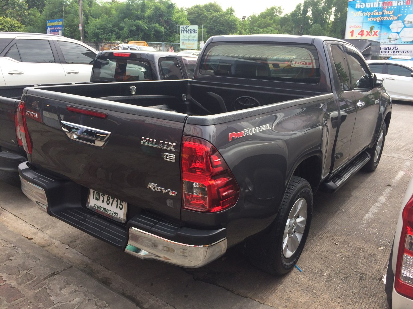 Pickup truck rear with open cargo bed and chrome bumper