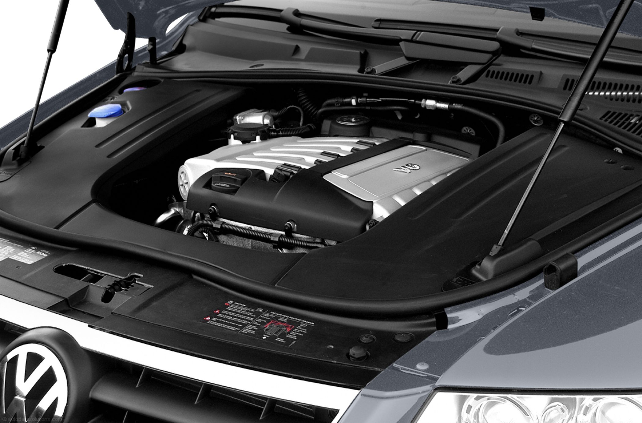 V8 engine bay with engine cover and car front details