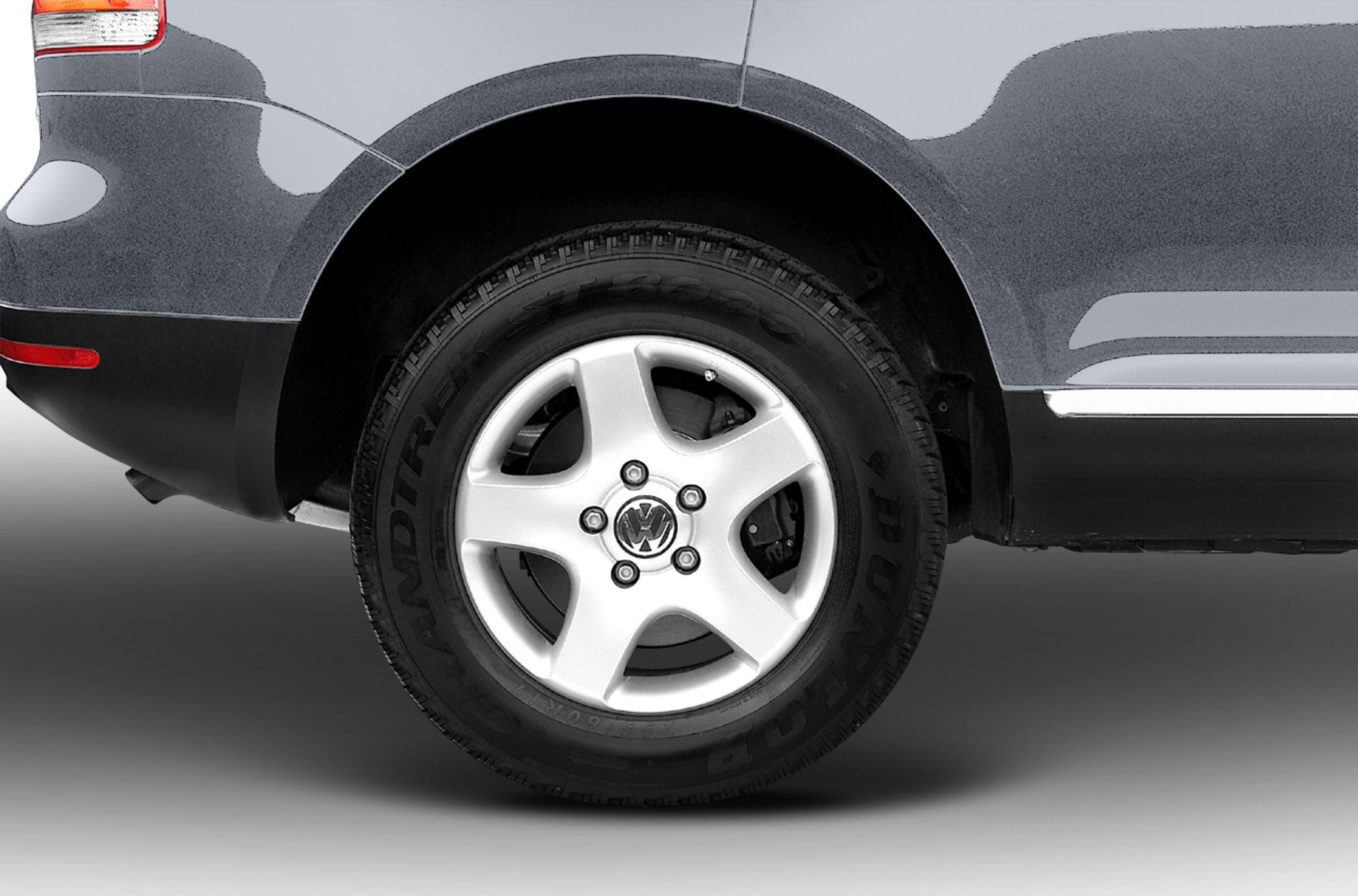Rear wheel with alloy rim and Dunlop tire on SUV