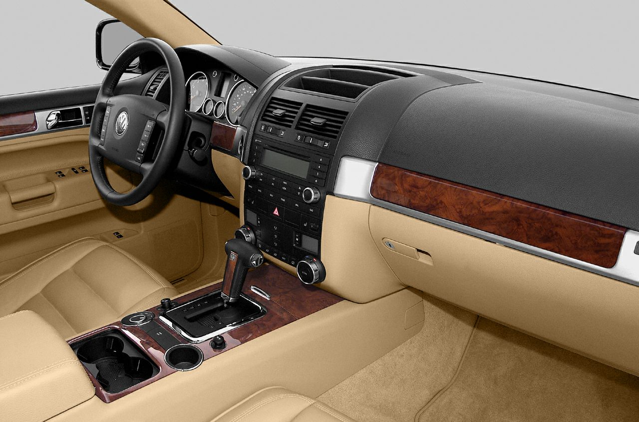 Beige leather interior with wood trim dashboard and center console