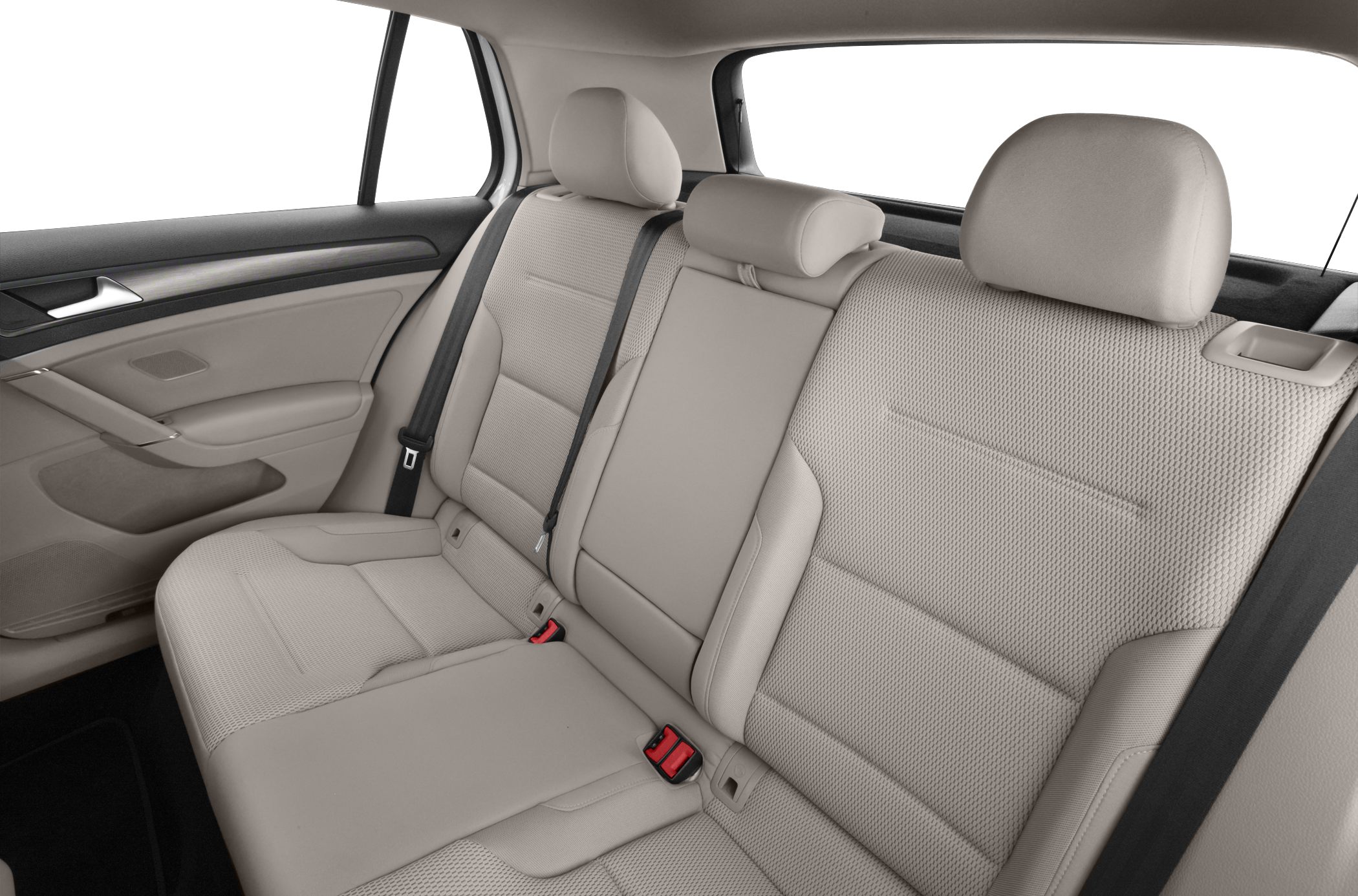 Beige rear seats with headrests and seatbelts in a compact hatchback