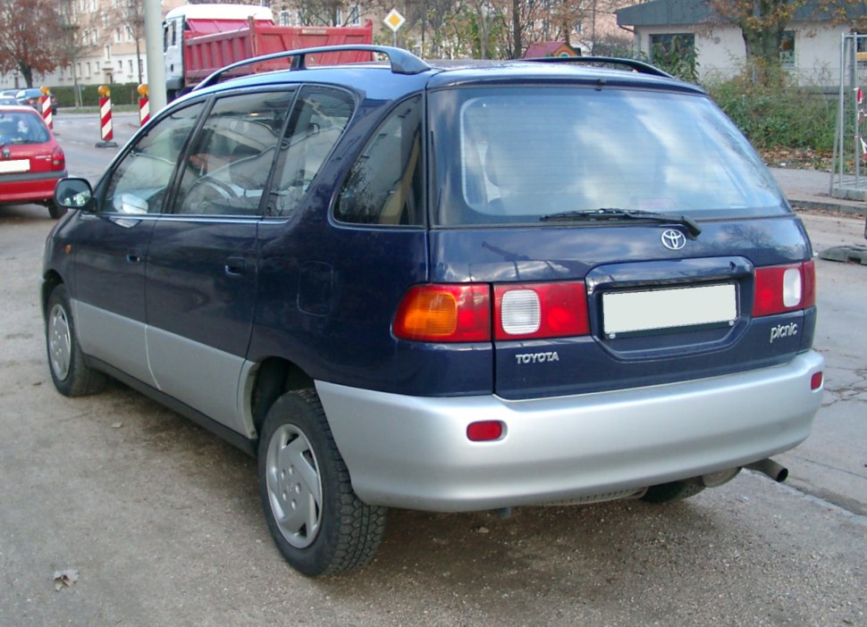 Rear and side view with two-tone blue and silver paint, hatchback design.