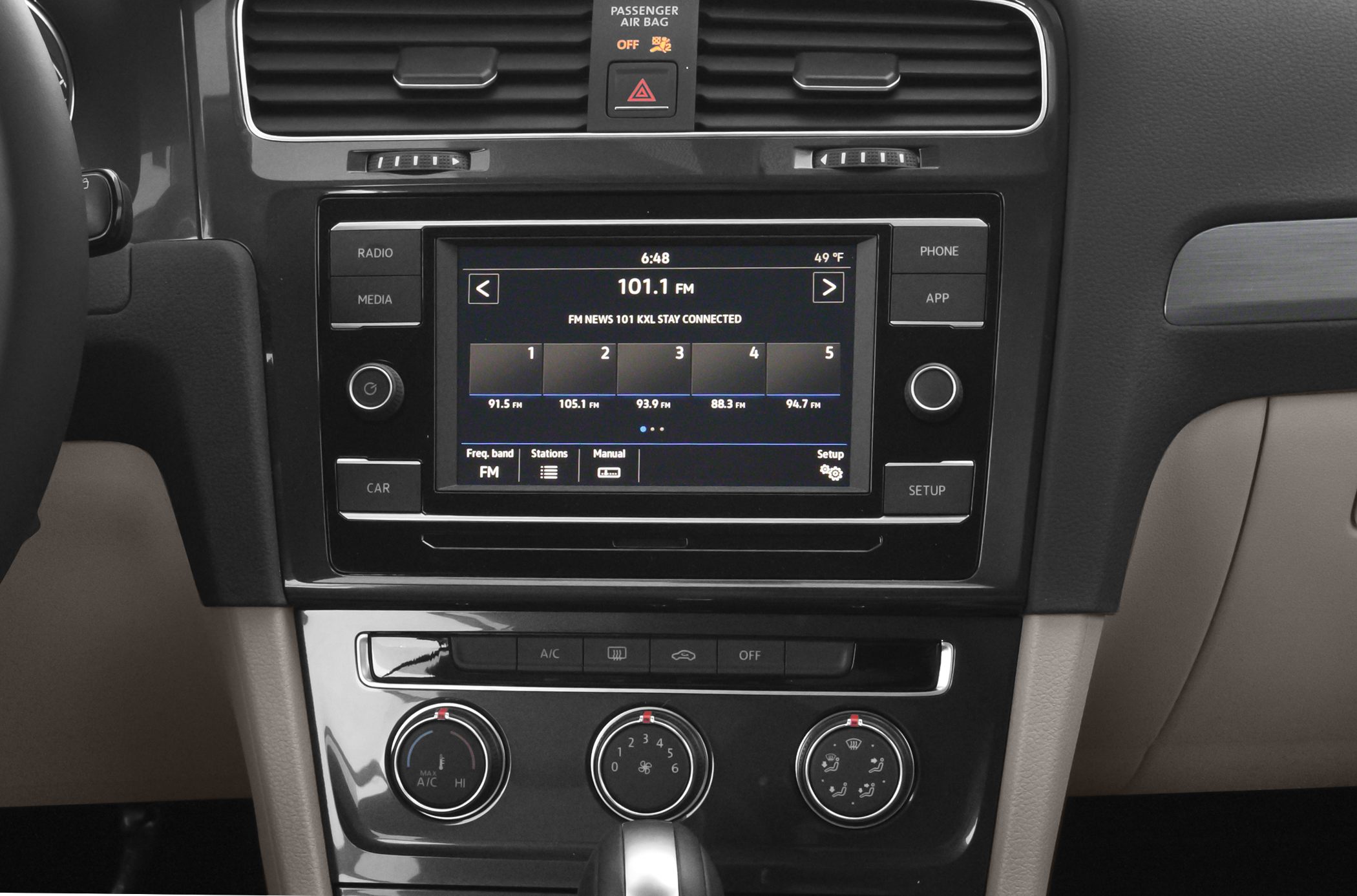 Infotainment display and climate controls in car dashboard