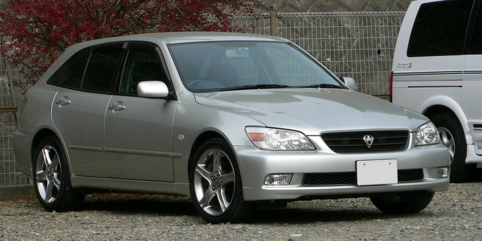 Sporty silver five-door hatchback with alloy wheels and clear headlights