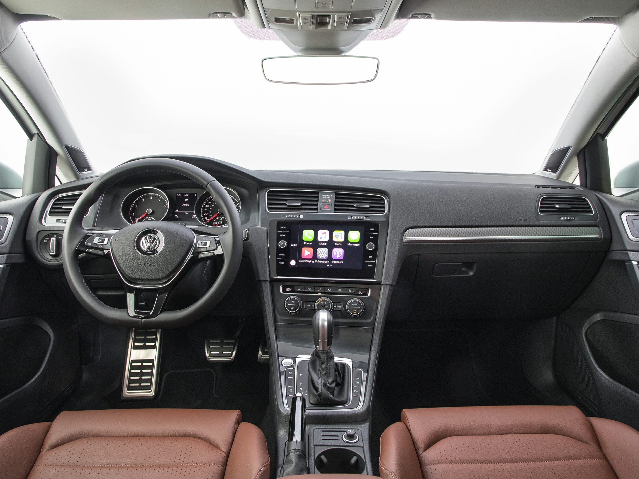 Dashboard, steering wheel, touchscreen, gear shift, brown seats
