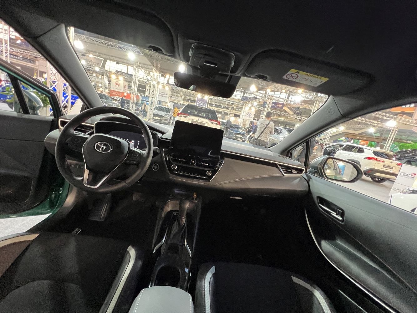 Dashboard, steering wheel, and infotainment system of a modern car interior
