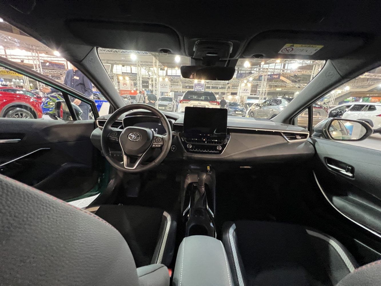 Modern car interior with digital cluster and touchscreen display