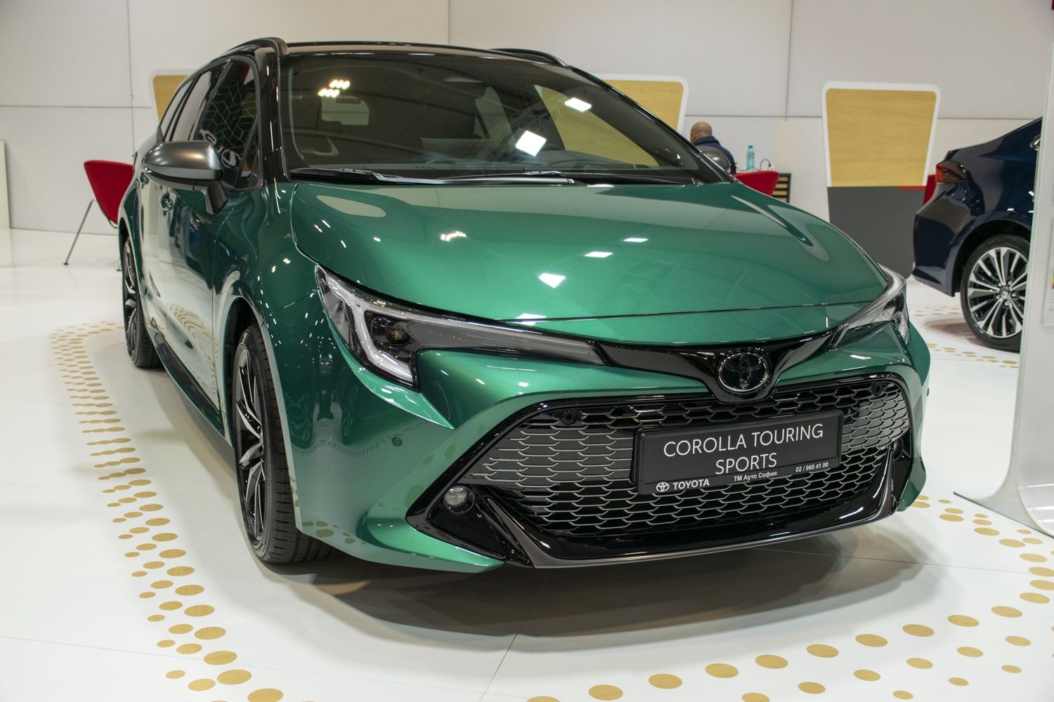 Front design with sleek headlights and black honeycomb grille
