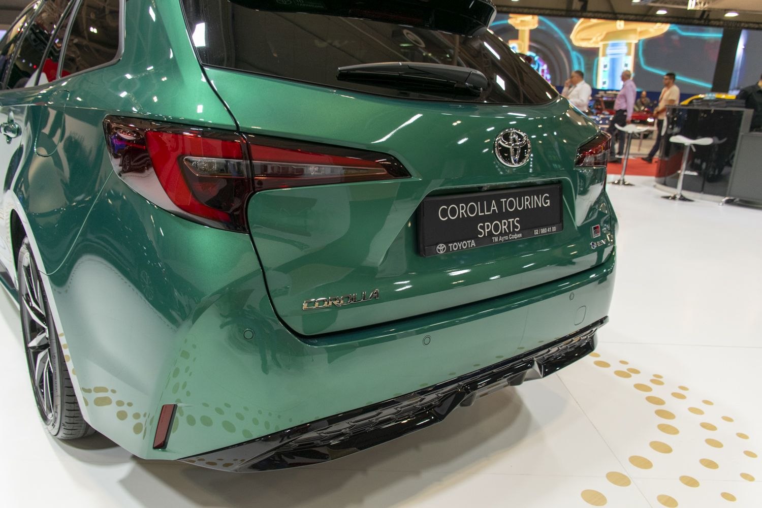 Rear end and tail lights of a modern station wagon with parking sensors