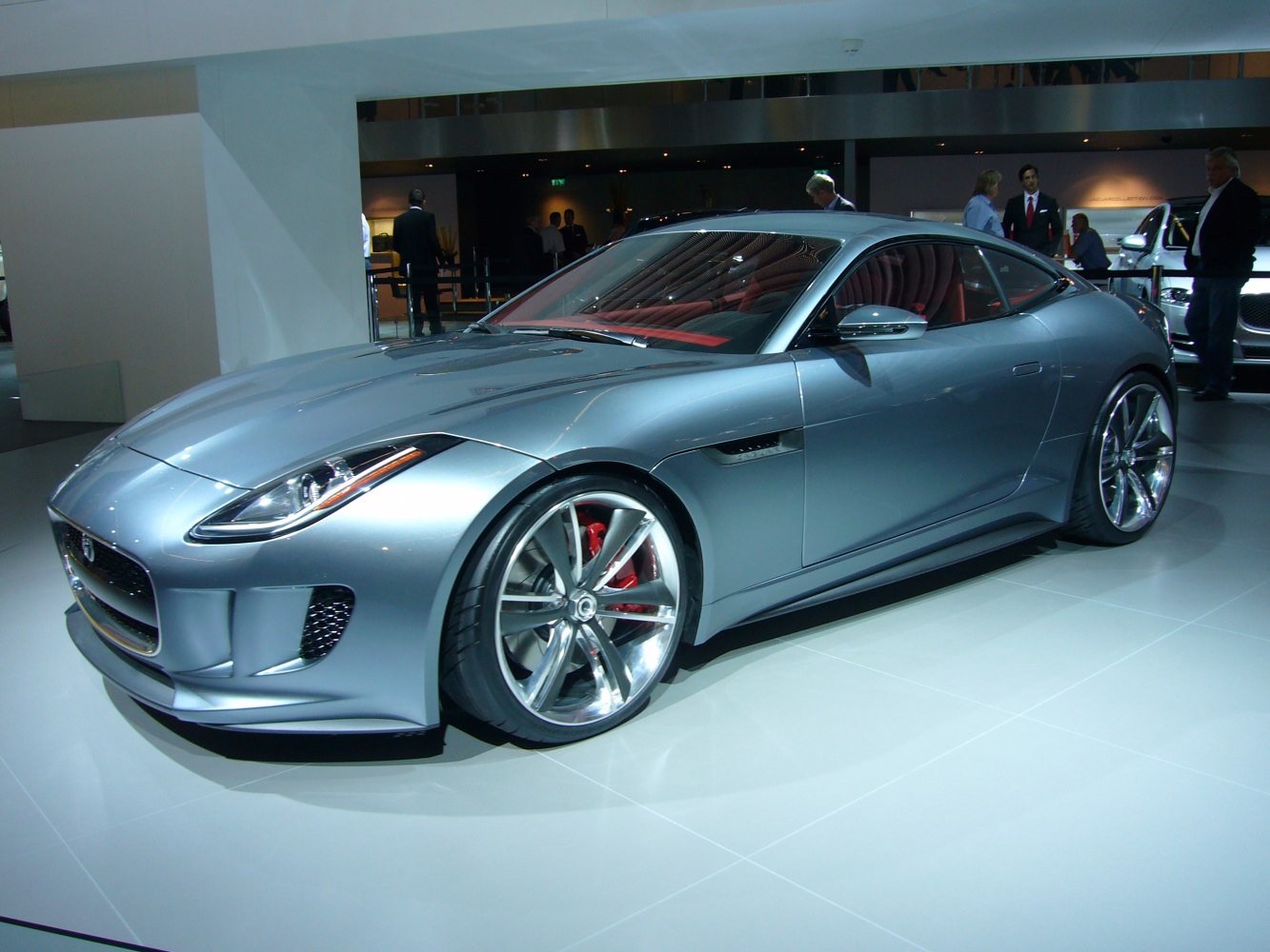 Silver sports coupe with aerodynamic front and alloy wheels