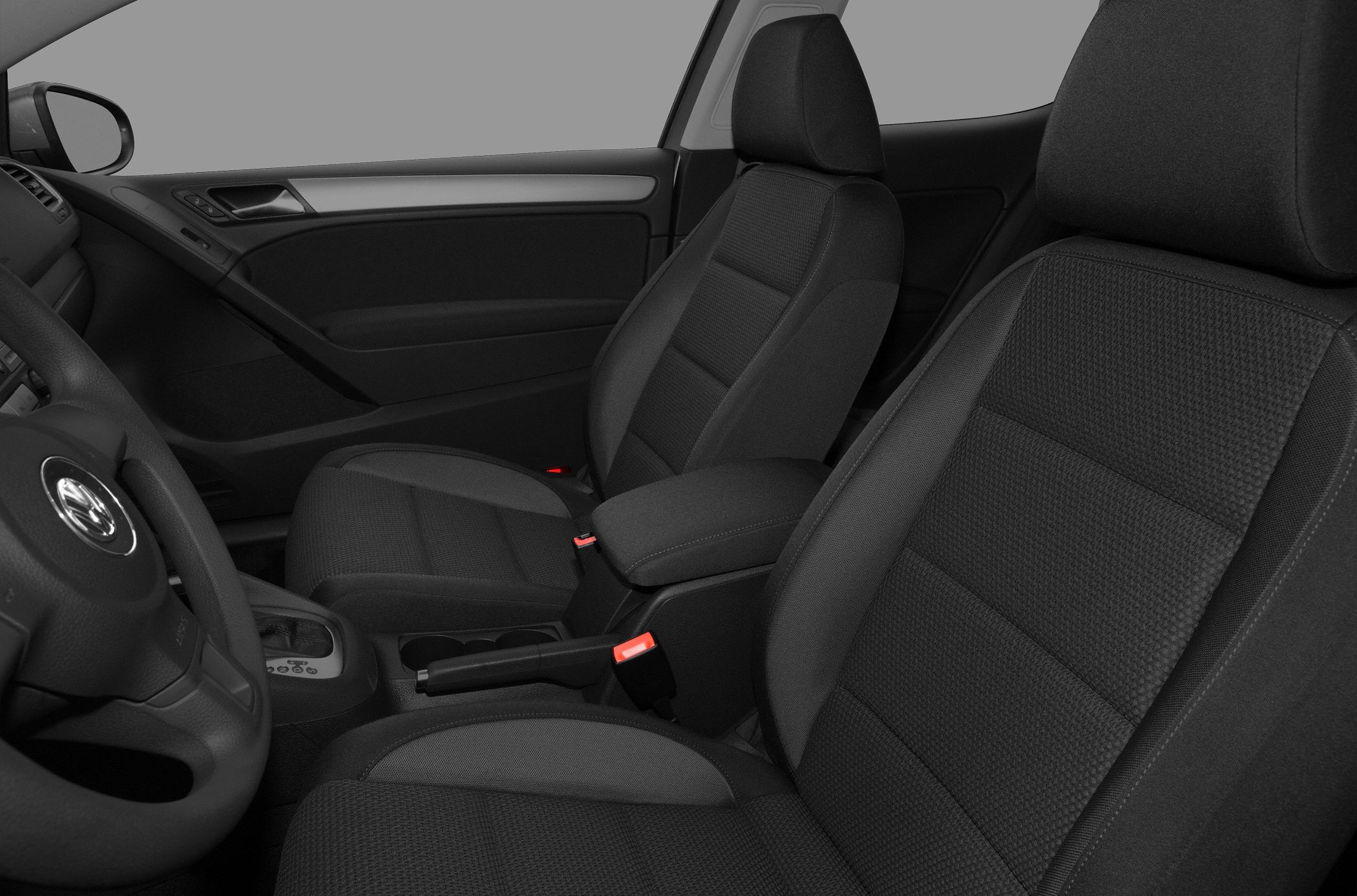 Front seats and center armrest of a car interior