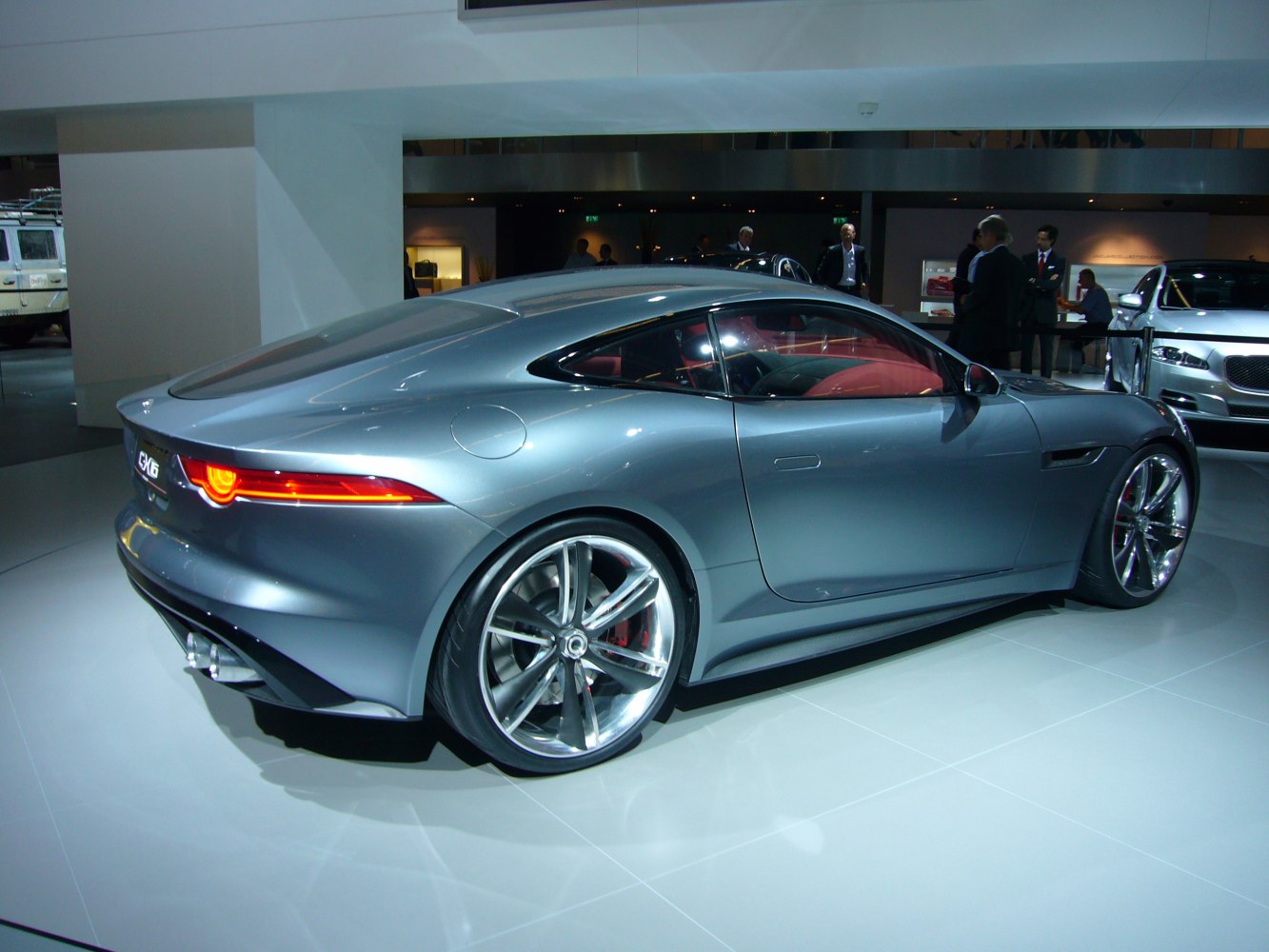 Silver sports coupe with LED tail lights and large alloy wheels.
