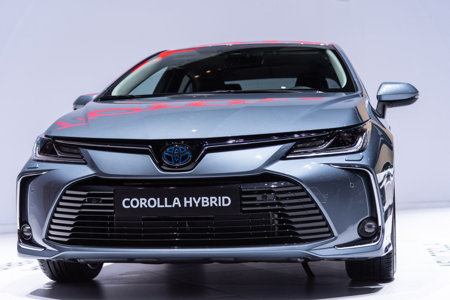 Front view with distinctive grille, headlights, and hybrid badge