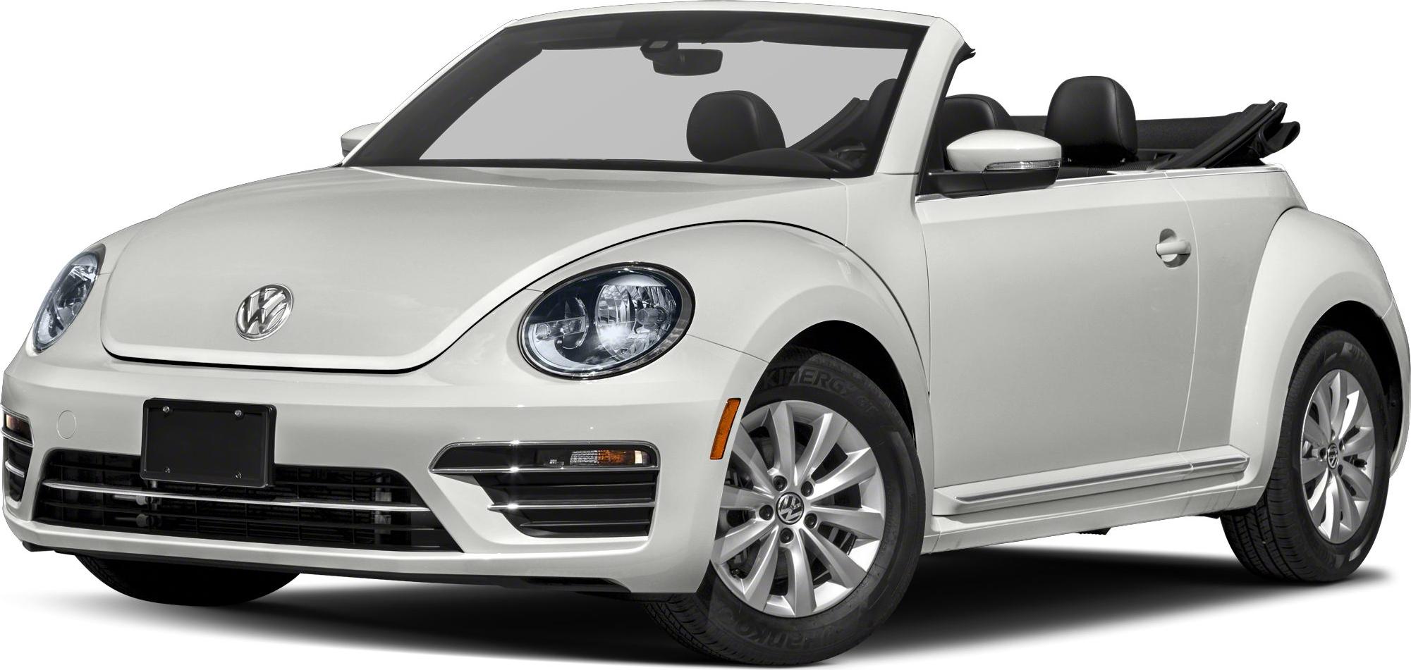 Front angle of a convertible with round headlights and alloy wheels