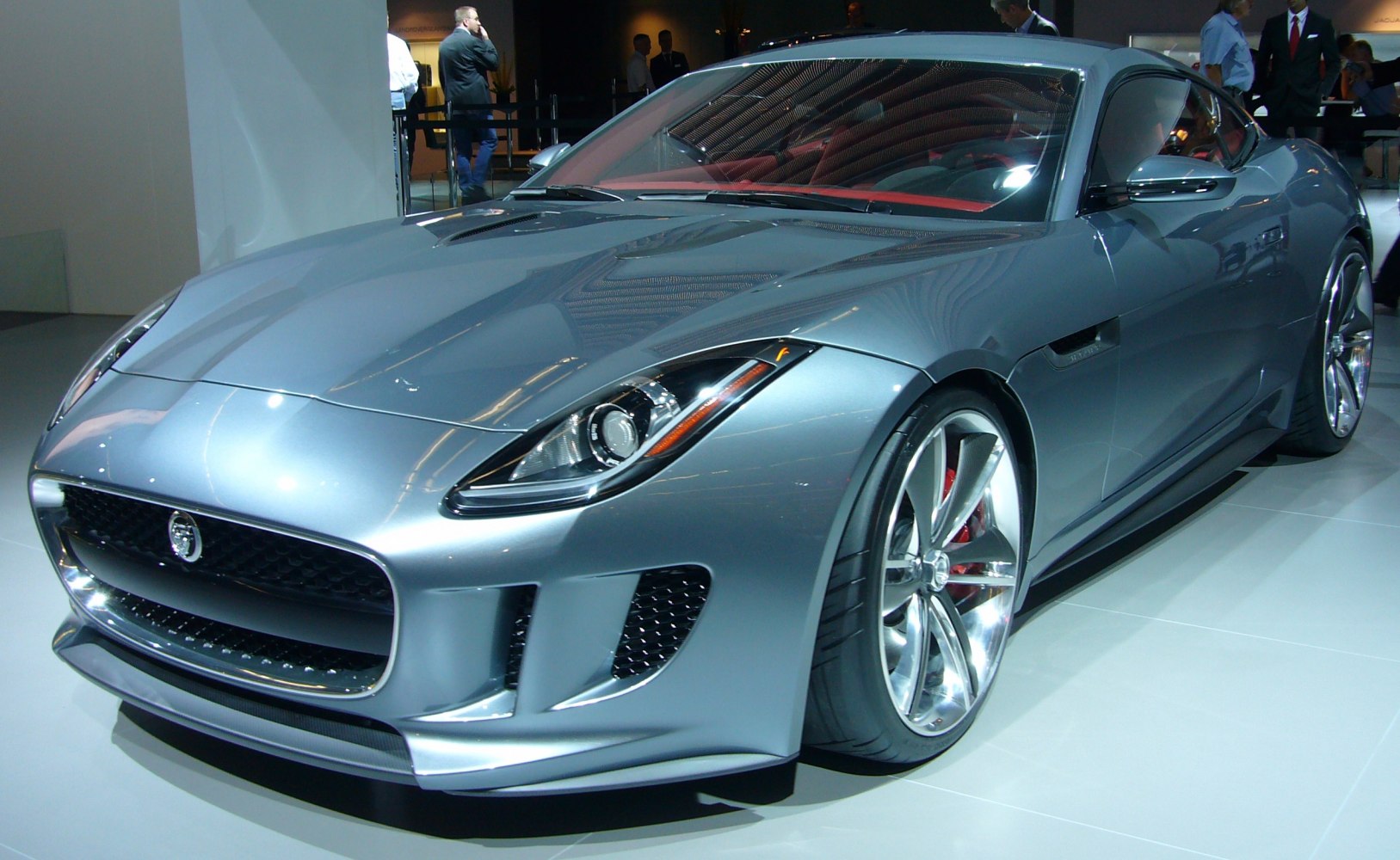 Front and side view of sleek sports coupe with aerodynamic design and alloy wheels