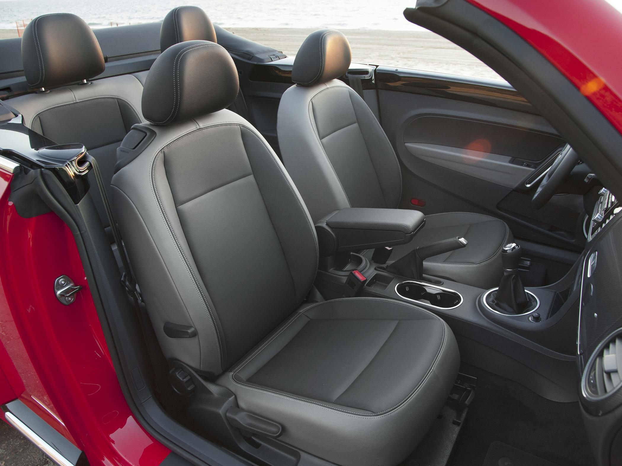 Front seats and center console of a convertible car interior