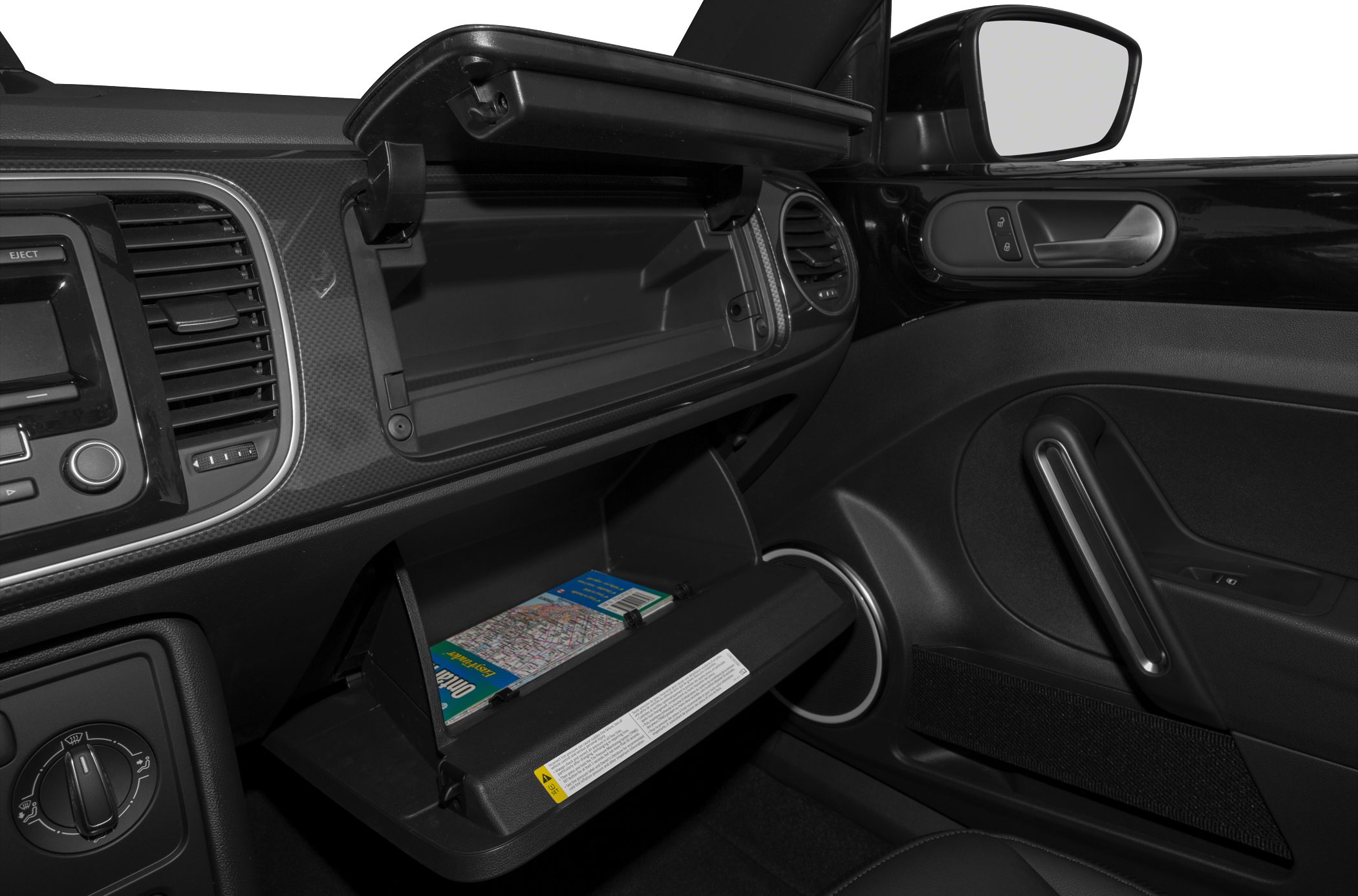 Open glove compartment with a folded map inside car interior