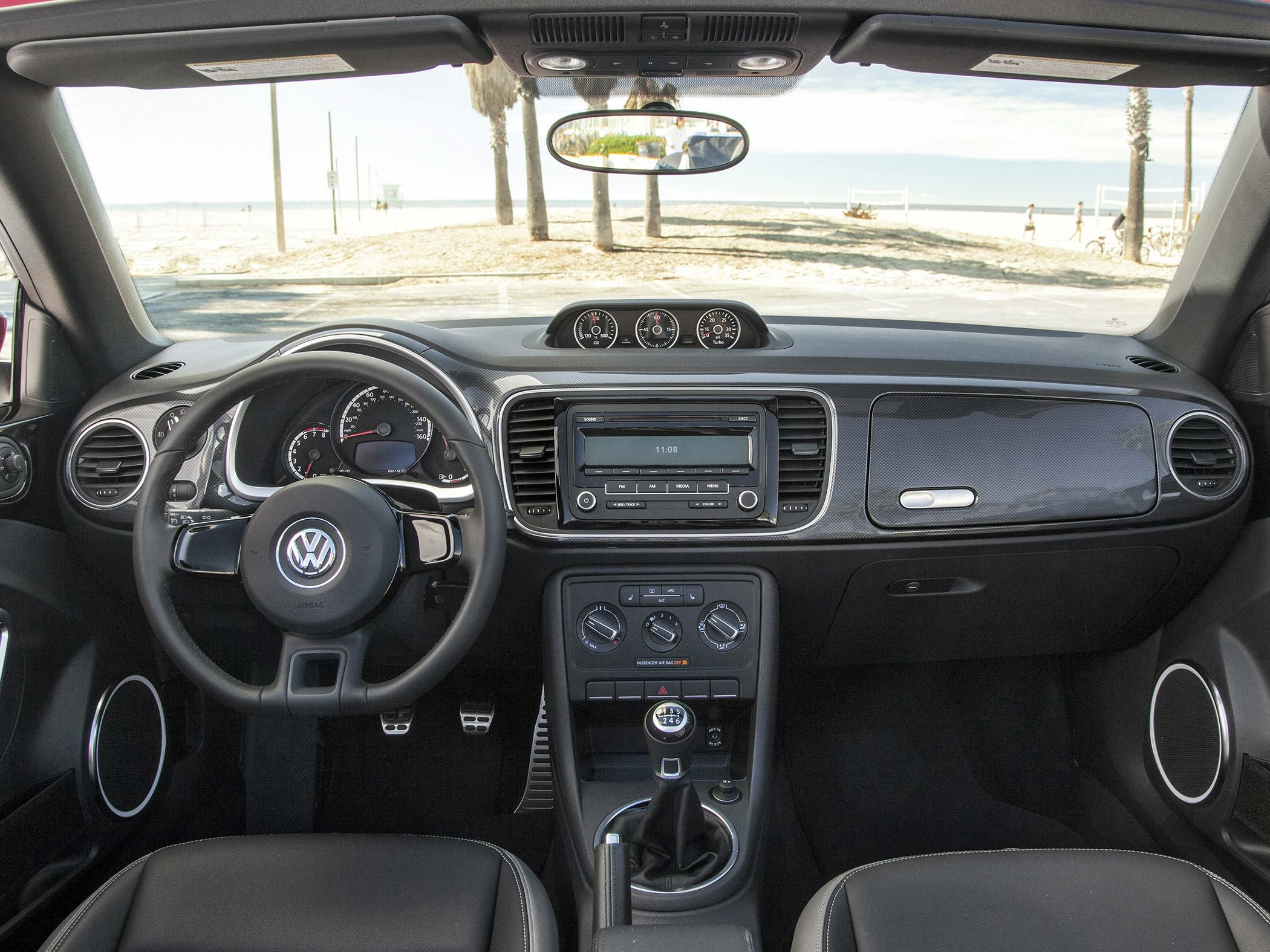 Dashboard interior with manual transmission and analog rooftop gauges