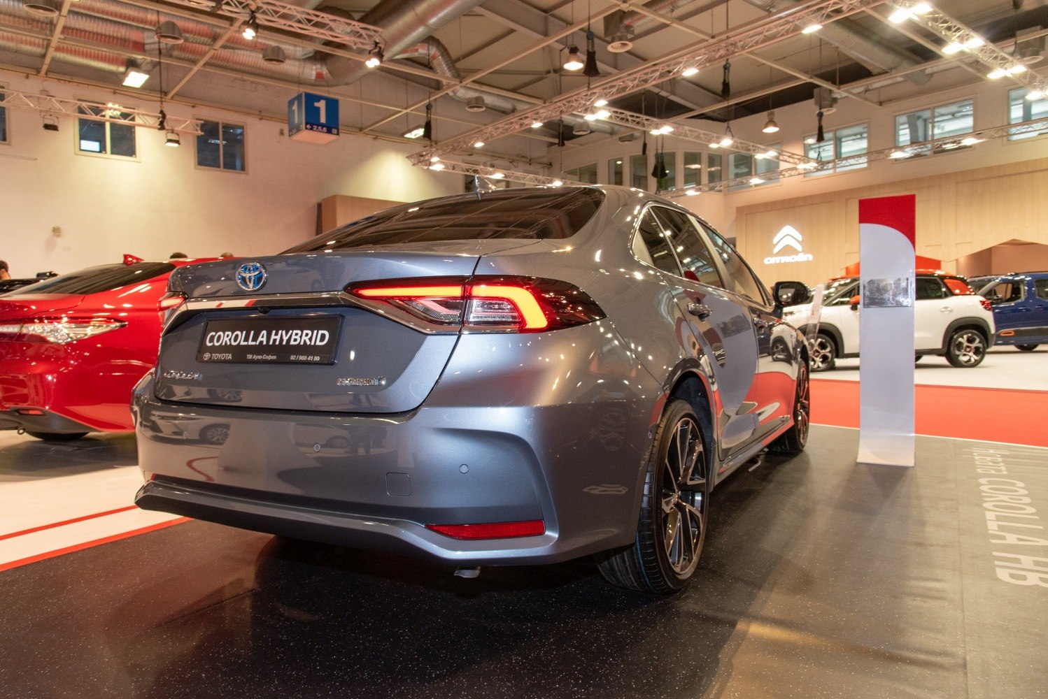 Sleek rear view with illuminated LED taillights and alloy wheels.