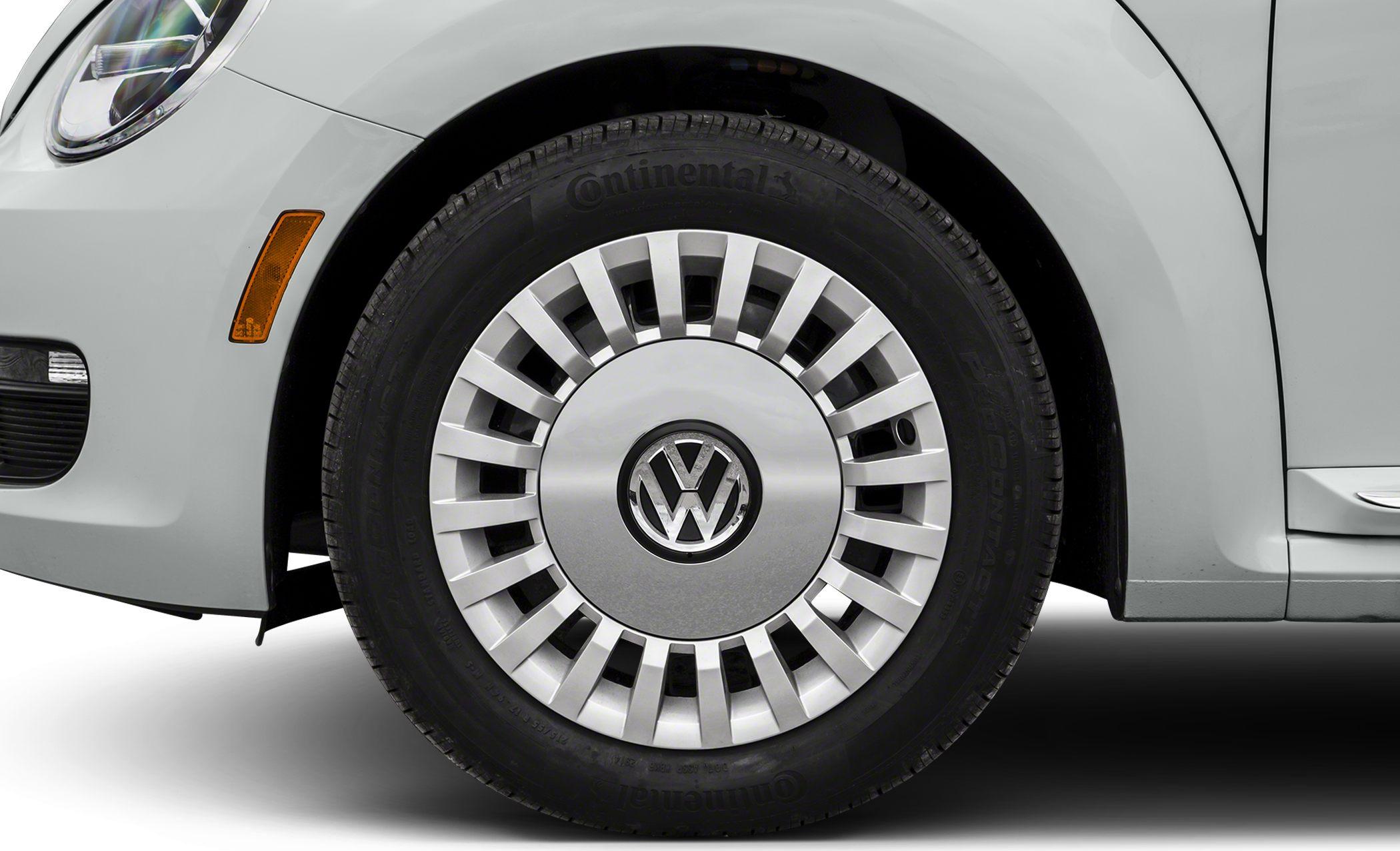 Close-up of retro-style wheel and tire on a car front fender